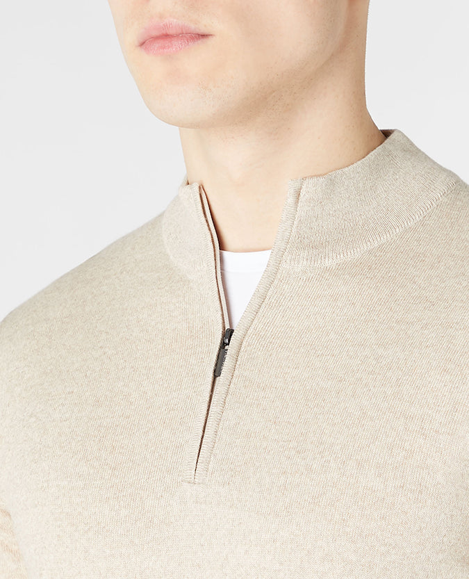 Man wearing a sand Tapered Fit Merino Wool Half Zip Sweater
