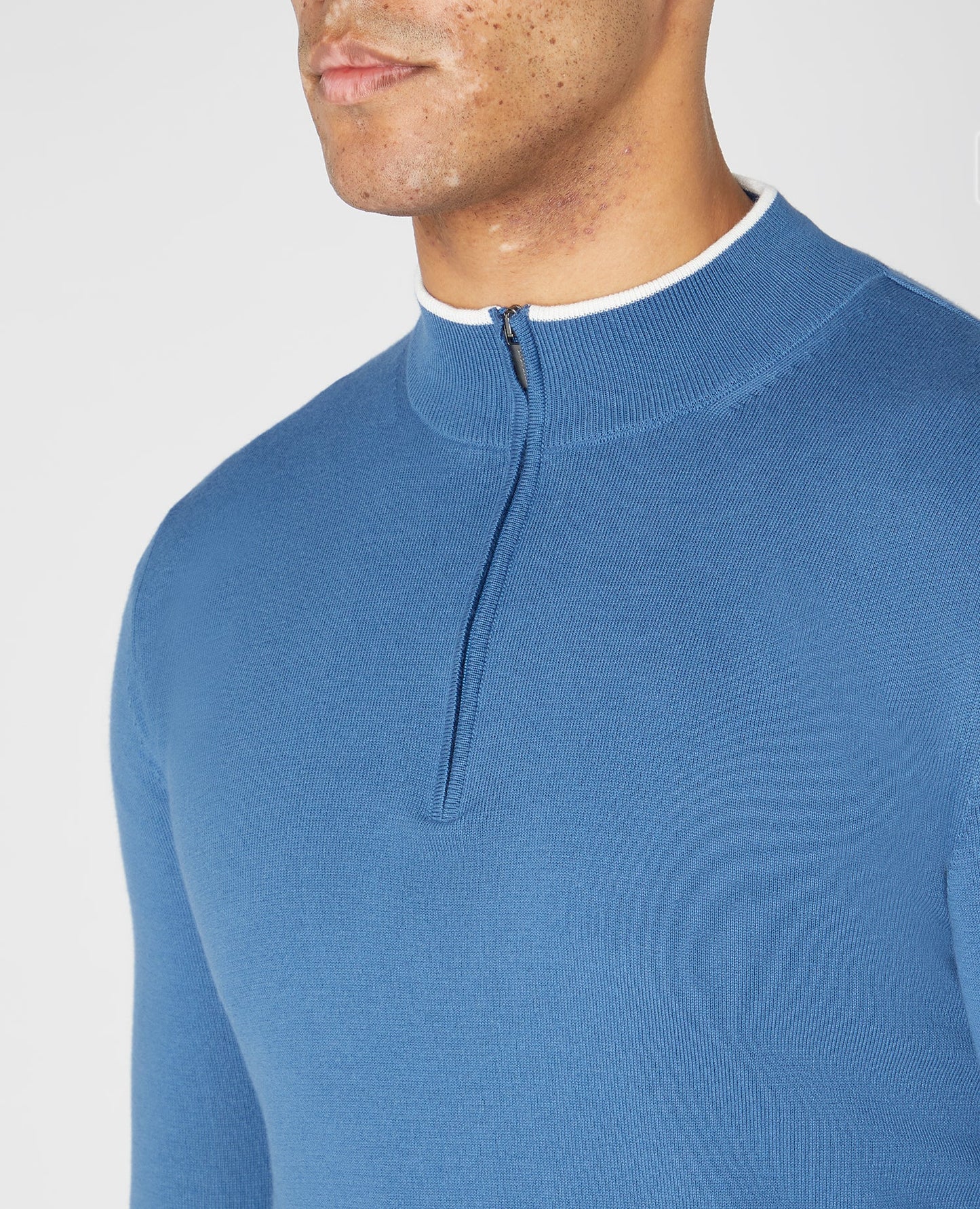 Man wearing a blue Slim Fit Knitted Cotton Half Zip Sweater