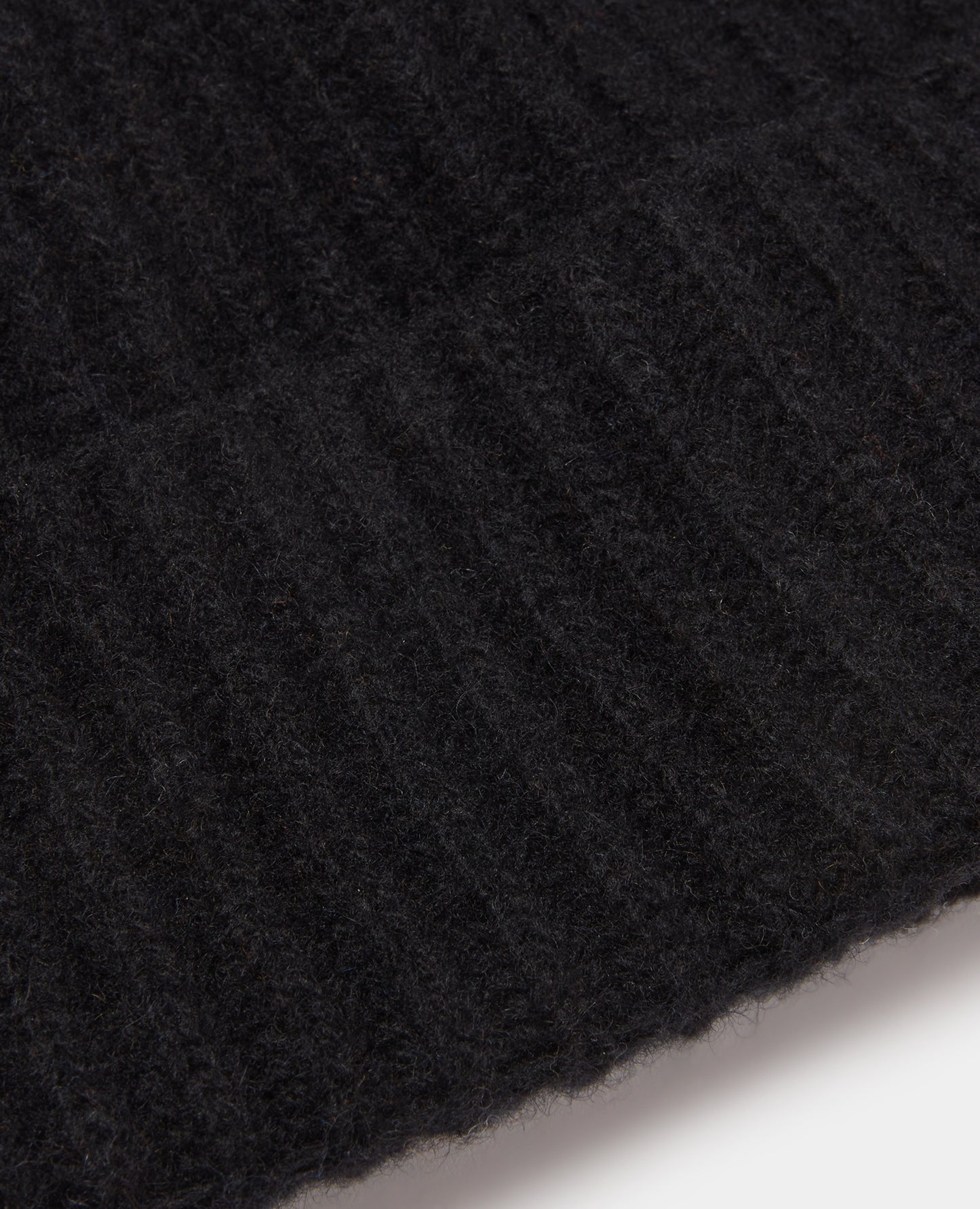 Man wearing a black Rib-Knit Wool Rich Beanie