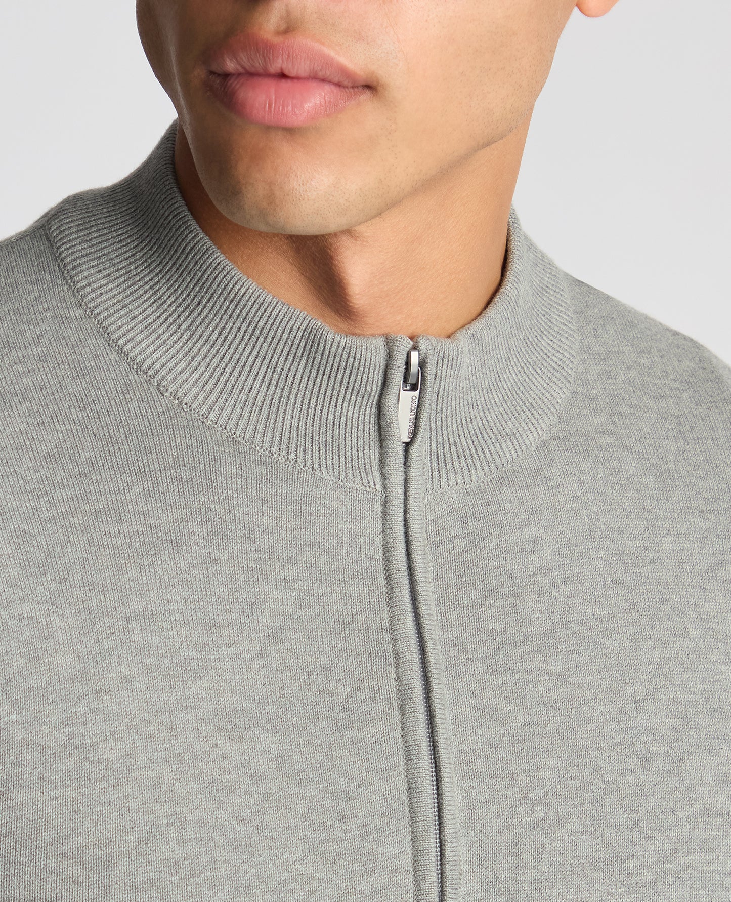 Man wearing a grey Tapered Fit Half Zip Cotton Sweater
