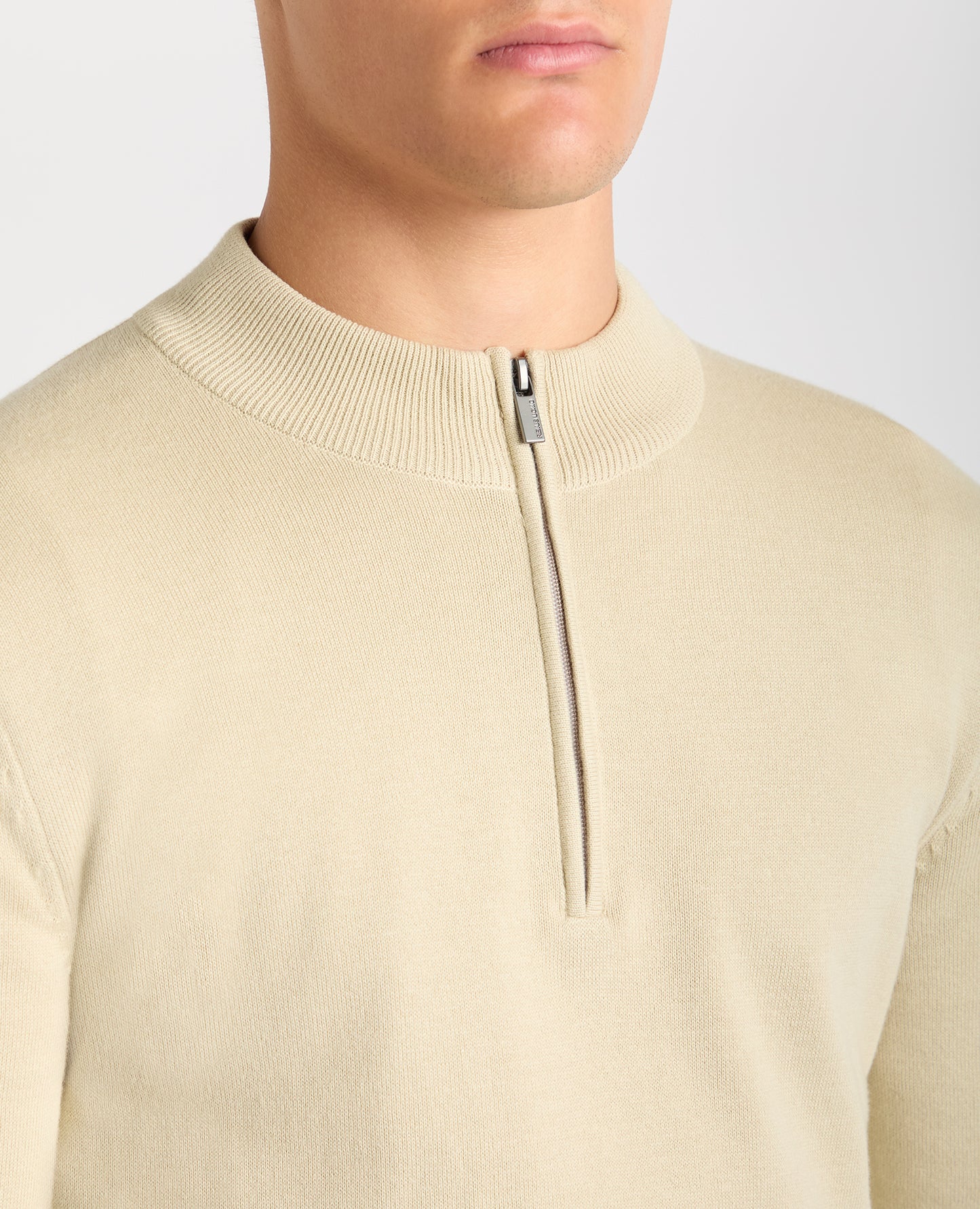 Man wearing a sand Tapered Fit Half Zip Cotton Sweater