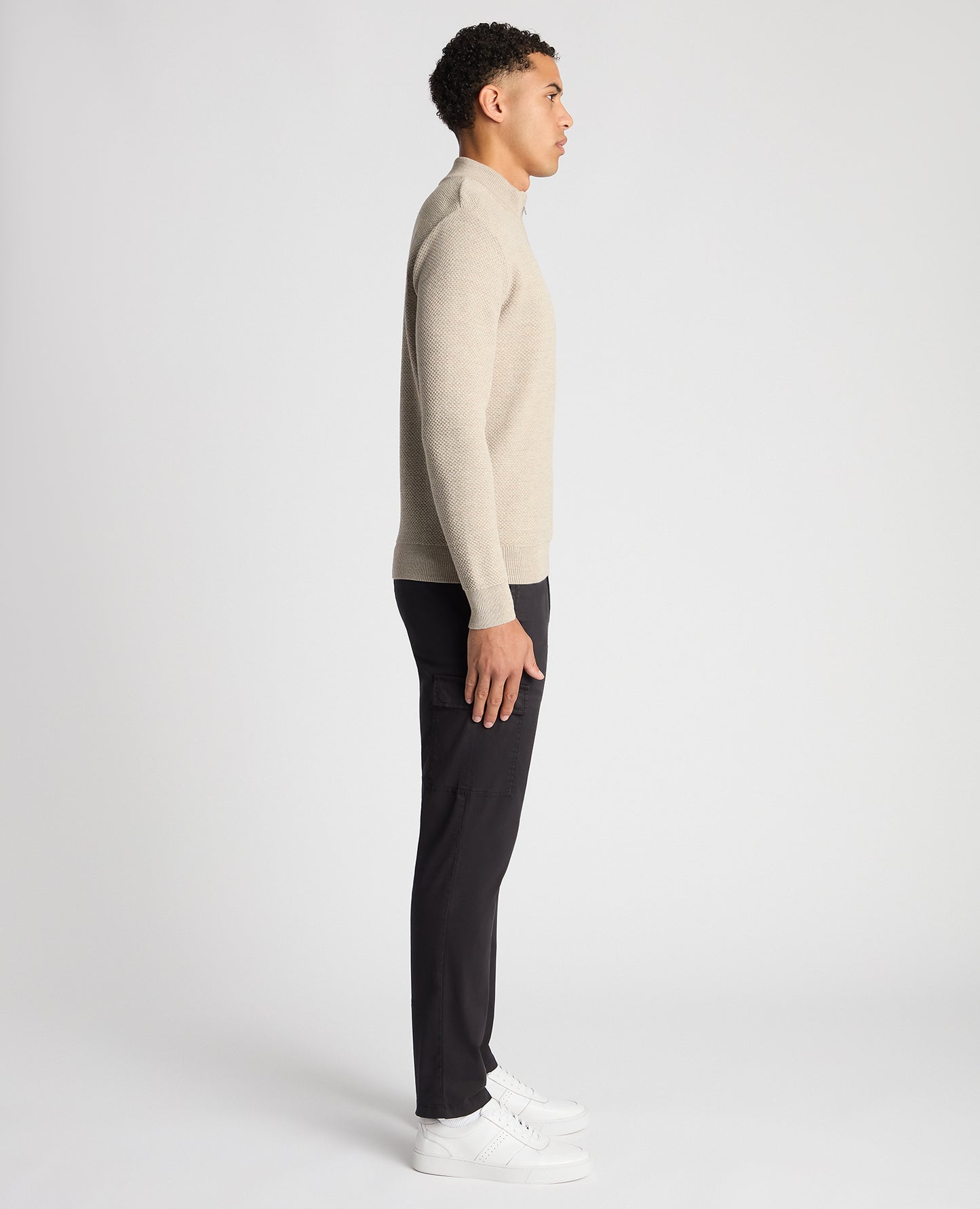 Man wearing a sand Tapered Fit Merino Half Zip Sweater