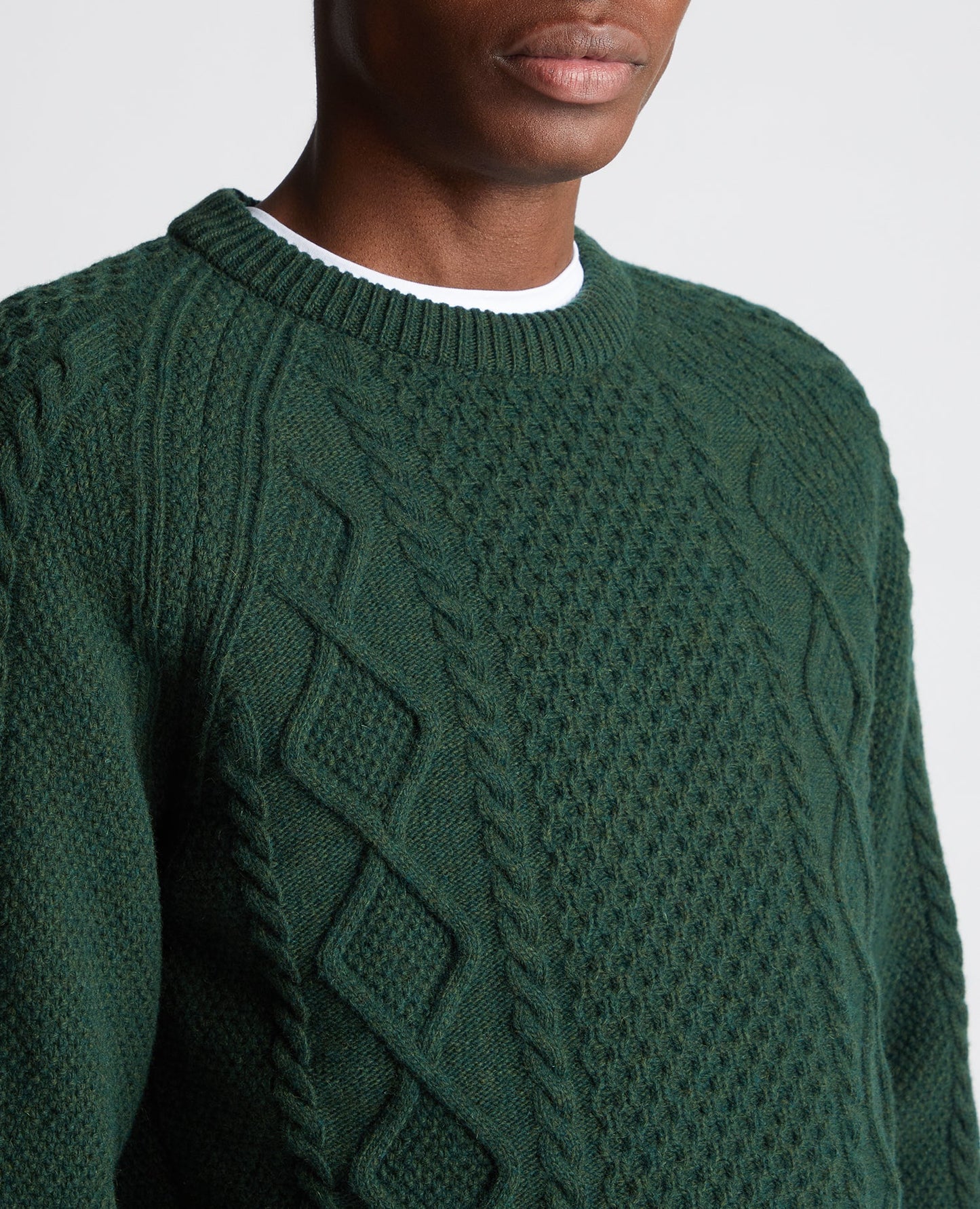 Man wearing a green Tapered Fit Wool-Blend Crew Neck Sweater