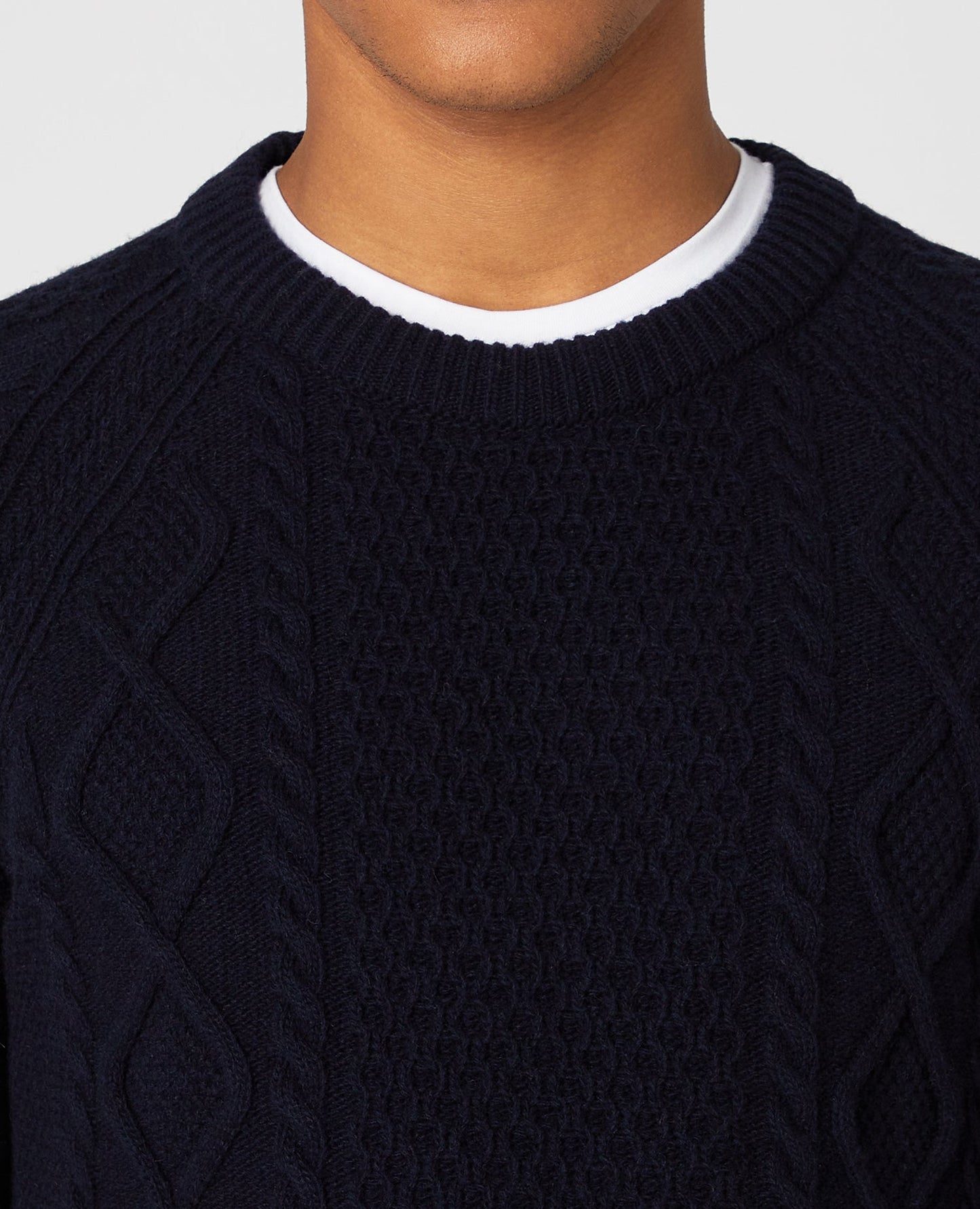 Man wearing a navy Tapered Fit Wool-Blend Crew Neck Sweater