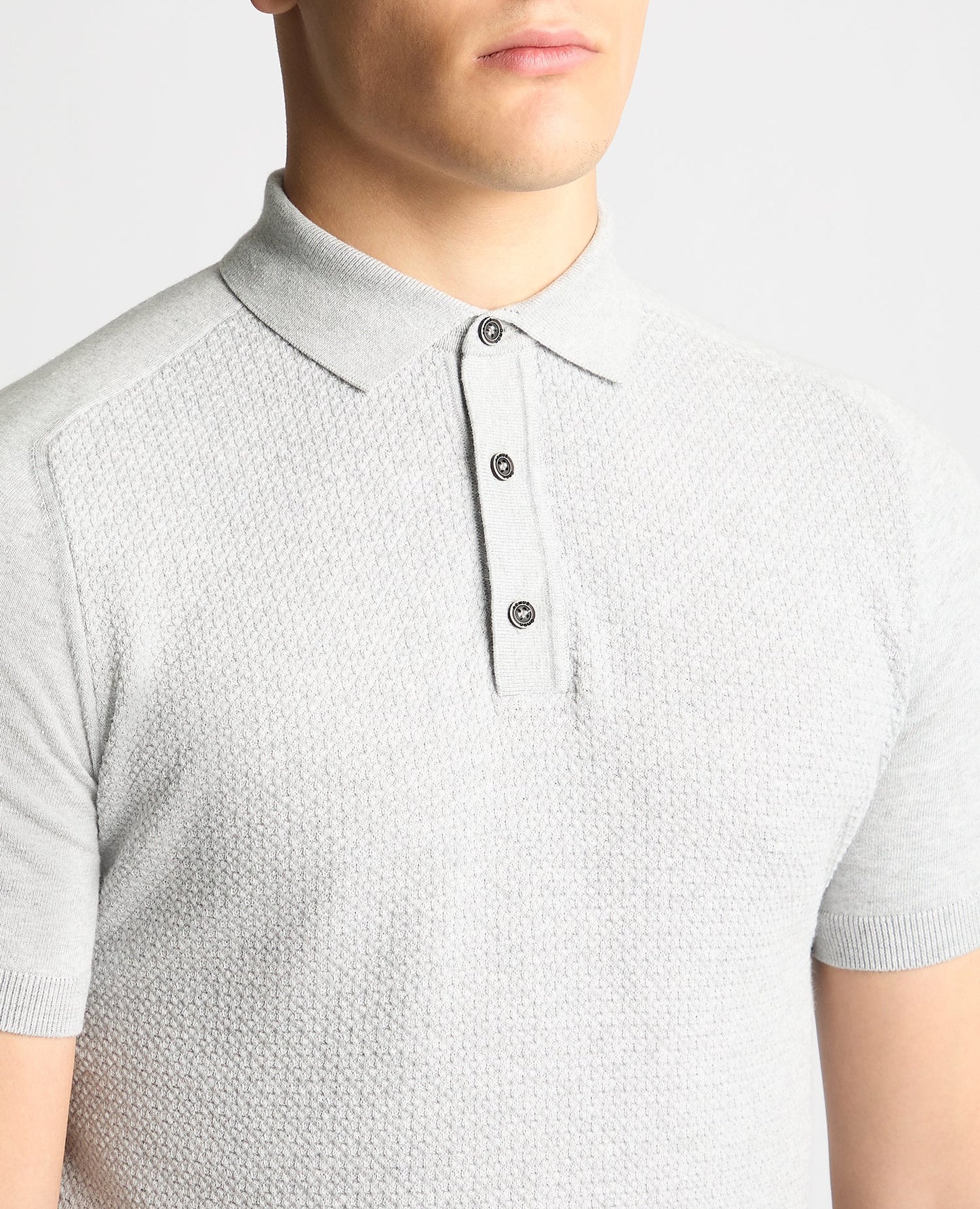 Man wearing a grey Knitted Cotton Short-Sleeve Polo Shirt