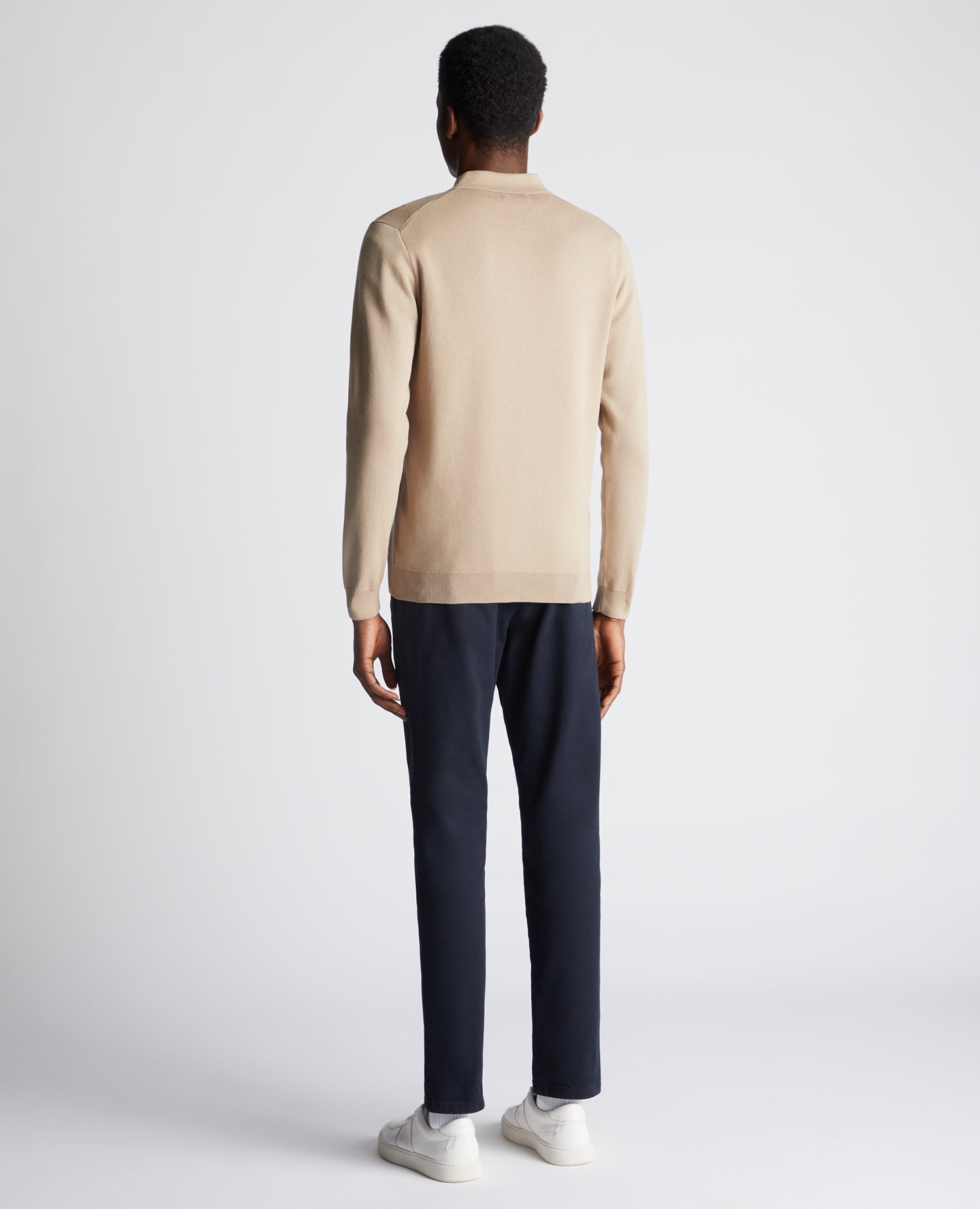 Man wearing a sand Relaxed Fit Long Sleeve Polo