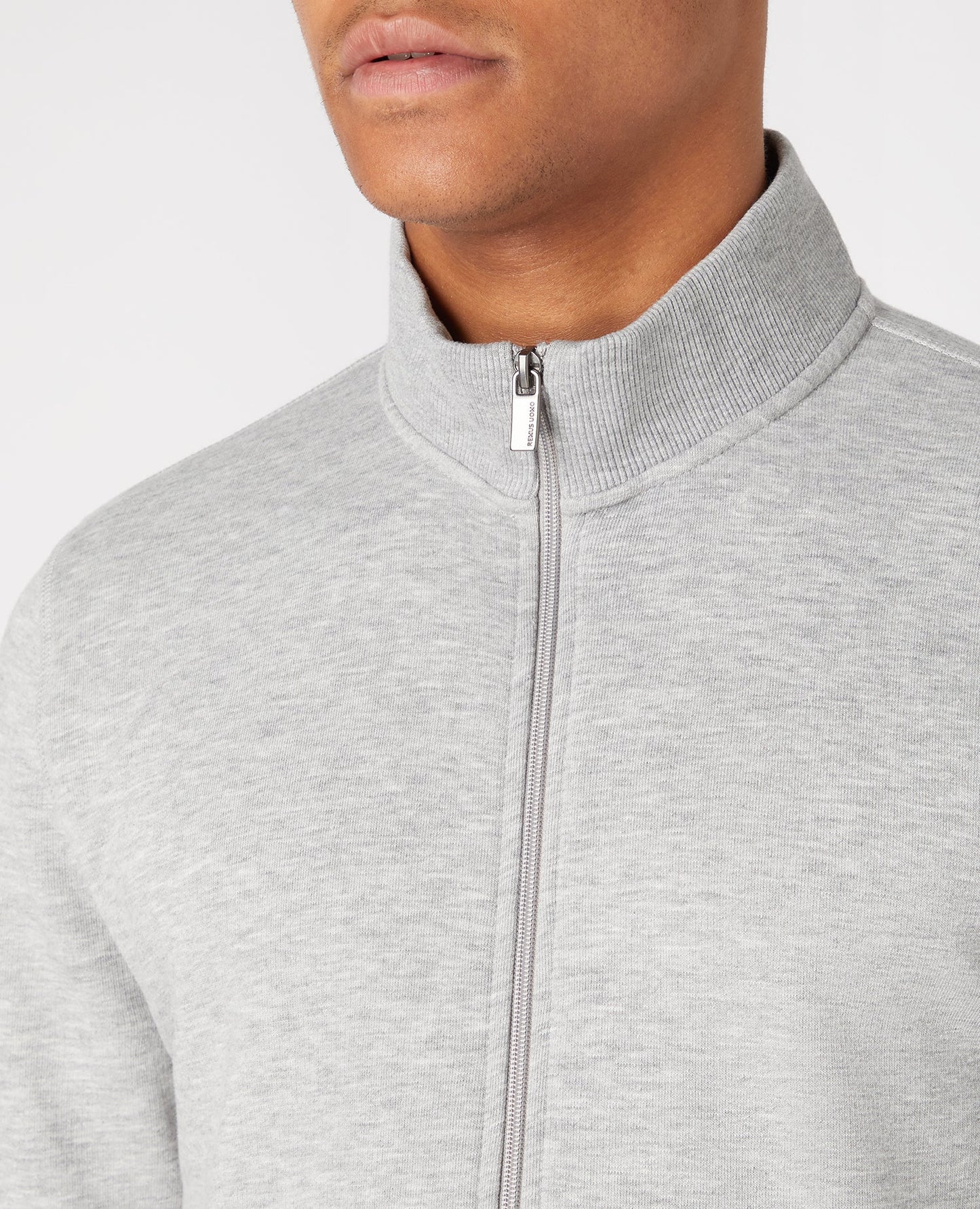 Man wearing a grey Tapered Cotton-Blend Full Zip Sweateshirt