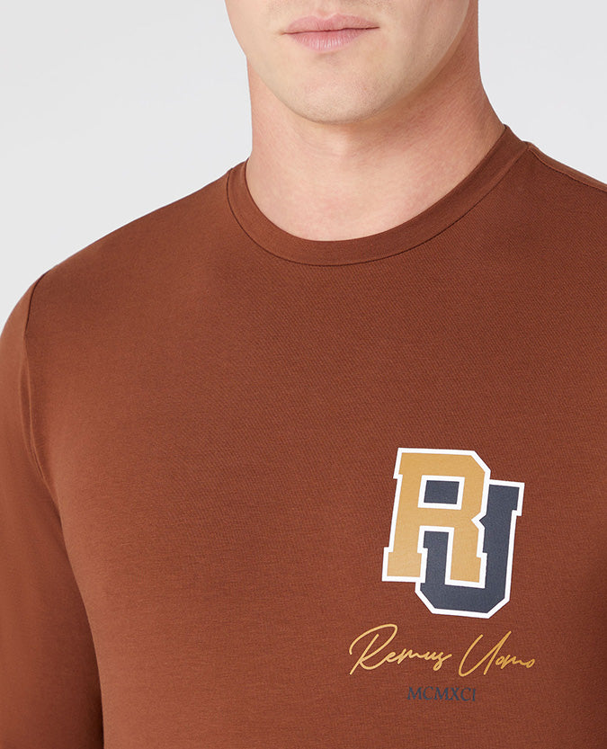 Man wearing a brown Tapered Fit Cotton-Stretch T-Shirt