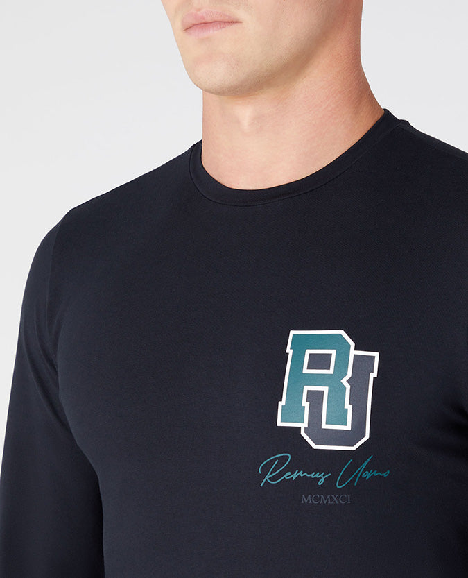 Man wearing a navy Tapered Fit Cotton-Stretch T-Shirt