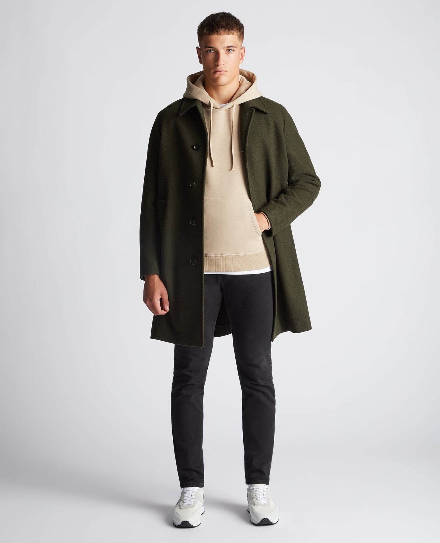 Man wearing a sand Tapered Fit Cotton-Blend Hoodie