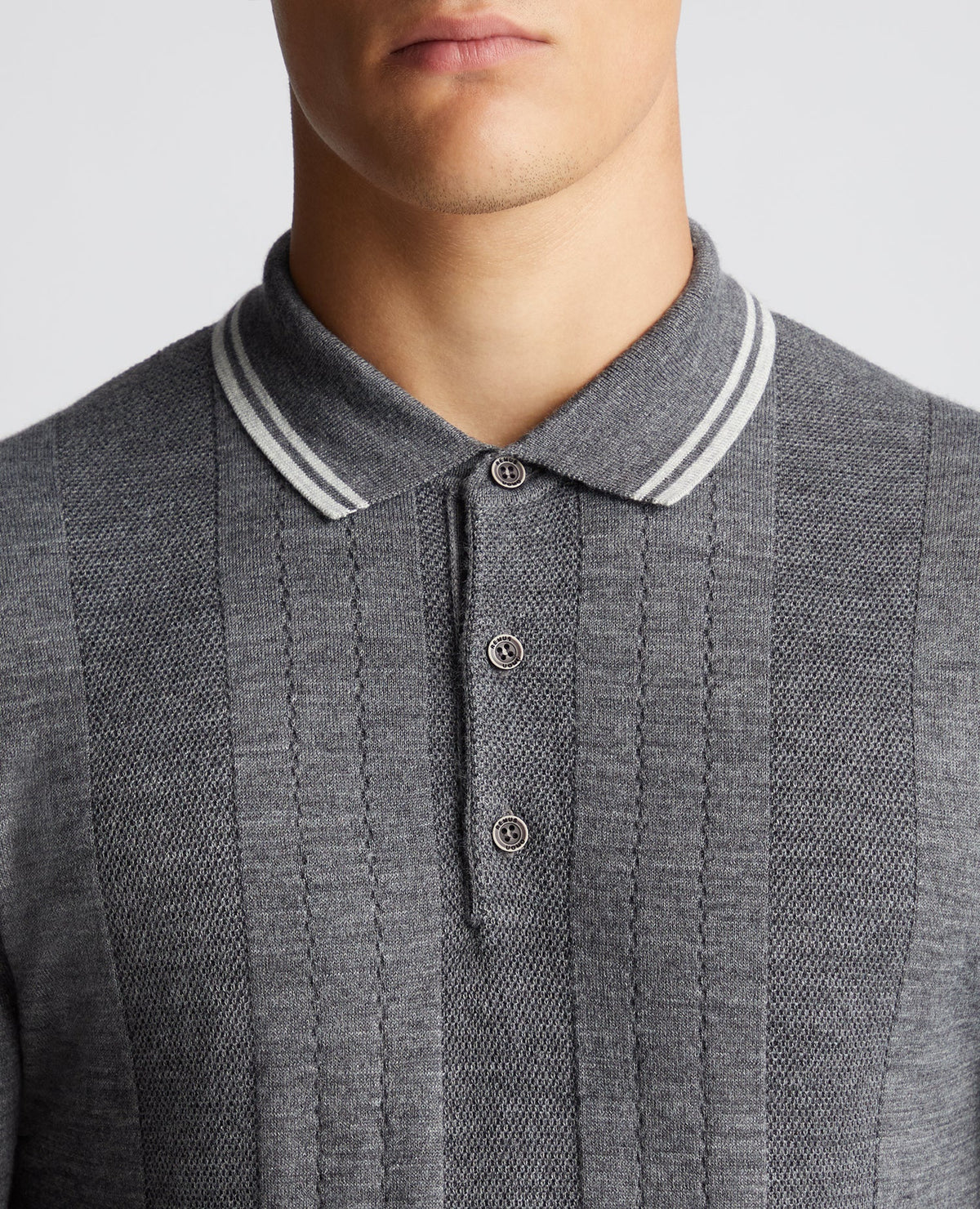 Man wearing a grey Slim Fit Merino Wool Knitted Polo