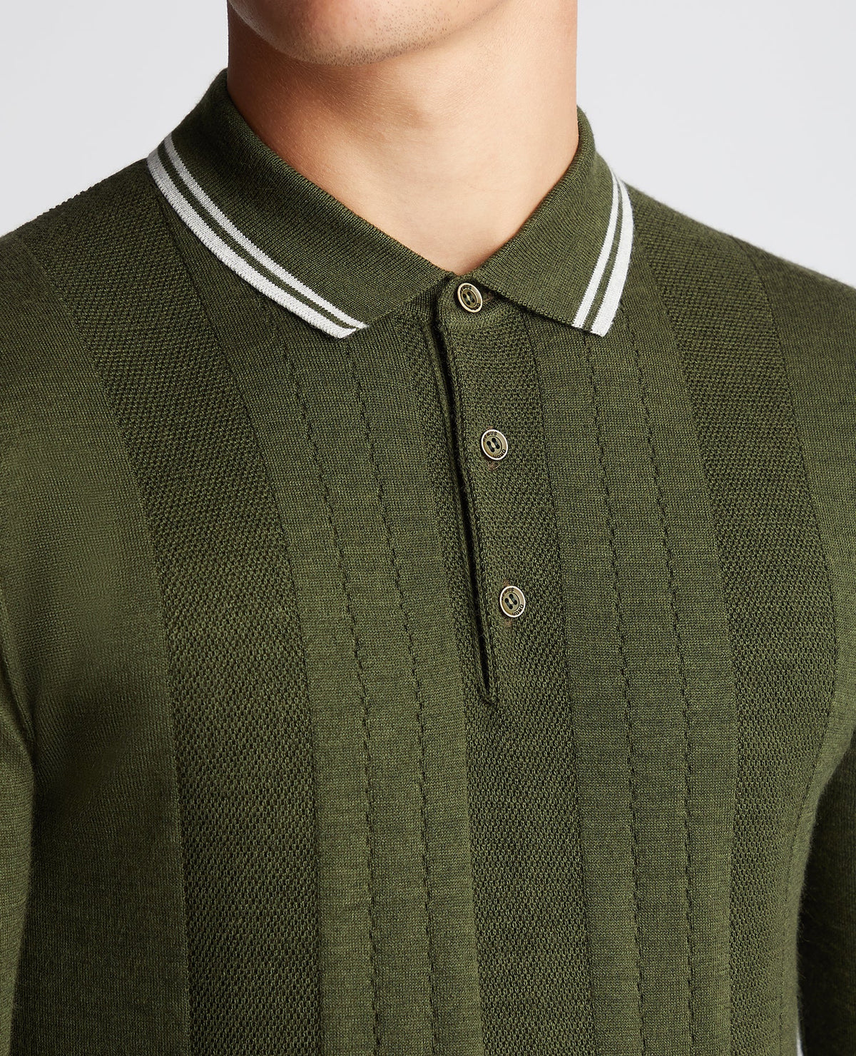 Man wearing a green Slim Fit Merino Wool-Blend Long Sleeve Knitted Polo