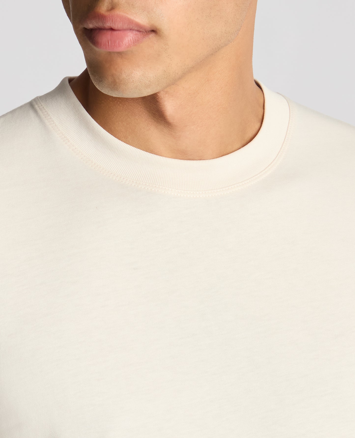Man wearing a sand Relaxed Fit Organic Cotton T-Shirt