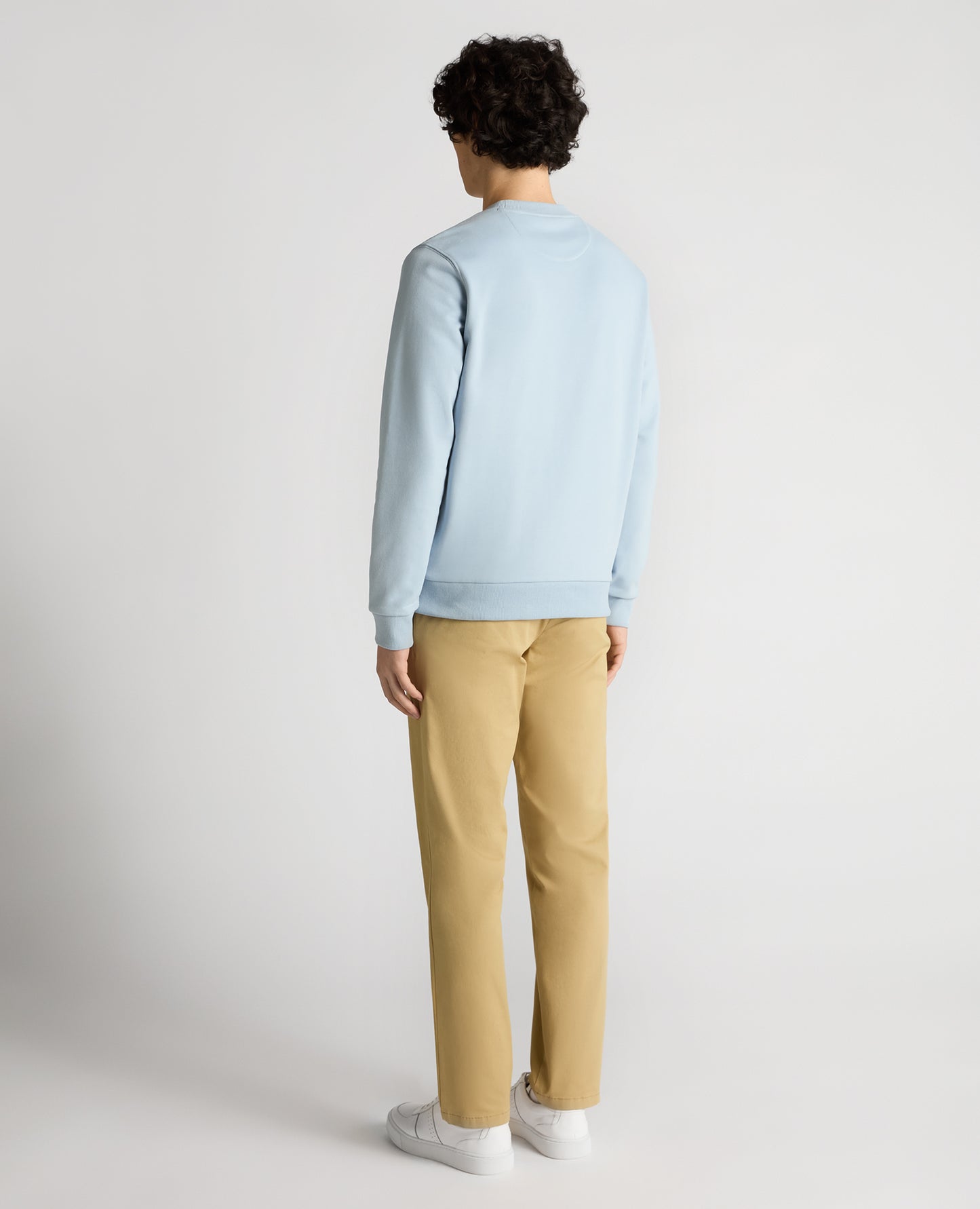 Man wearing a blue Tapered Fit Soft Touch Cotton-Blend Sweatshirt