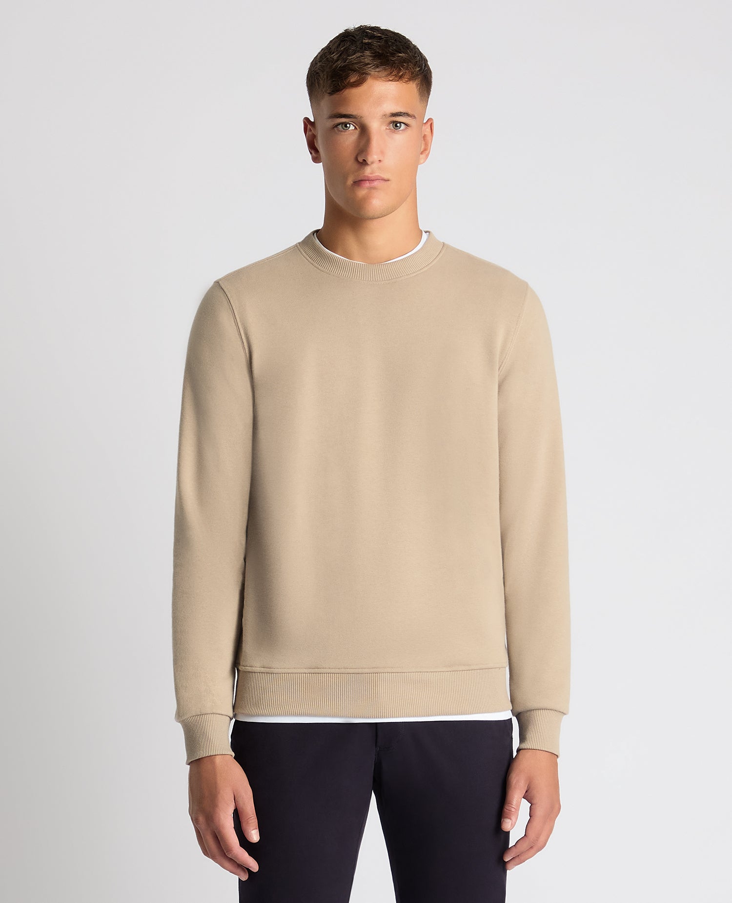 Man wearing a sand Tapered Fit Soft Touch Cotton-Blend Sweatshirt