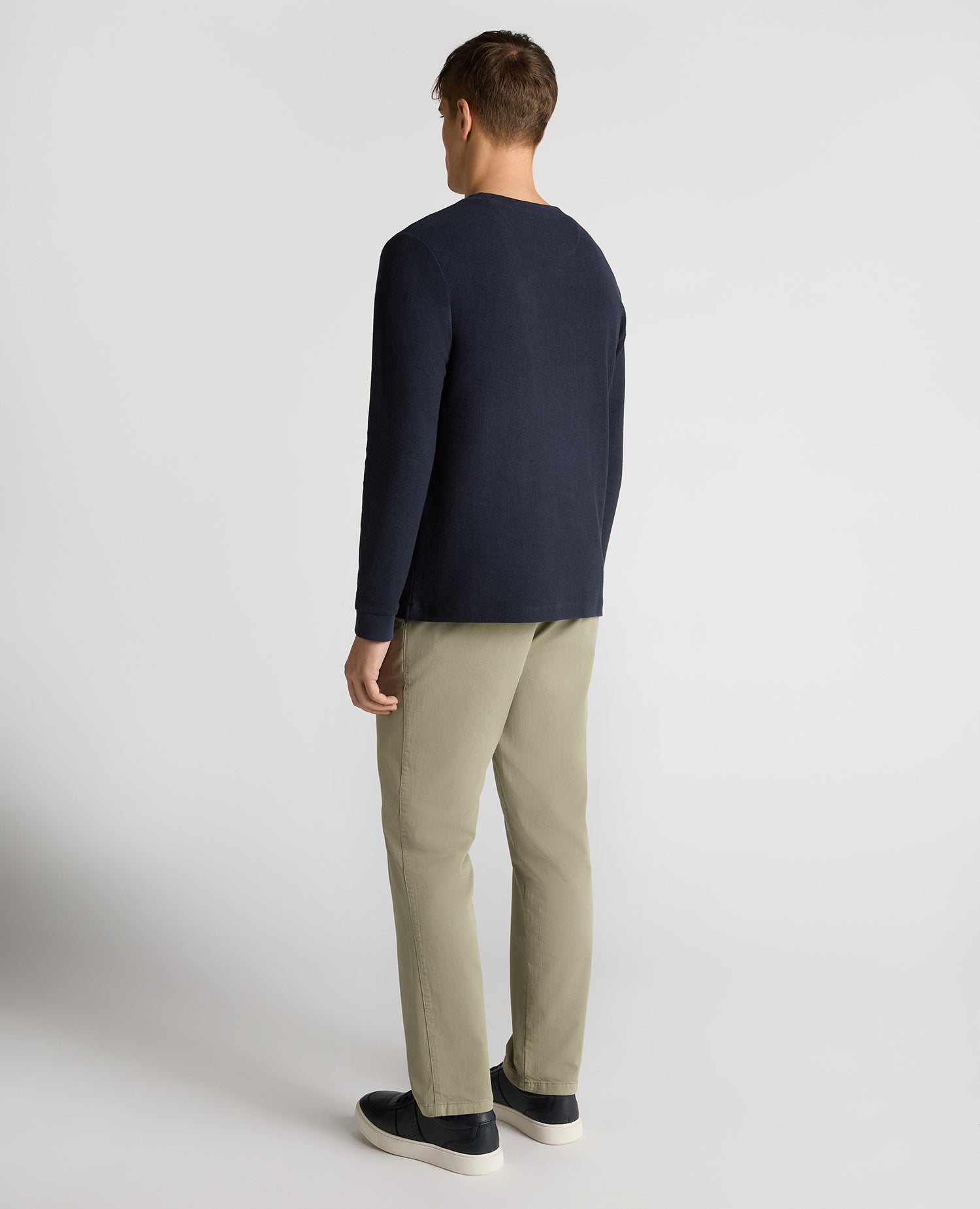 Man wearing a navy Tapered Fit Cotton Micro Waffle Sweatshirt