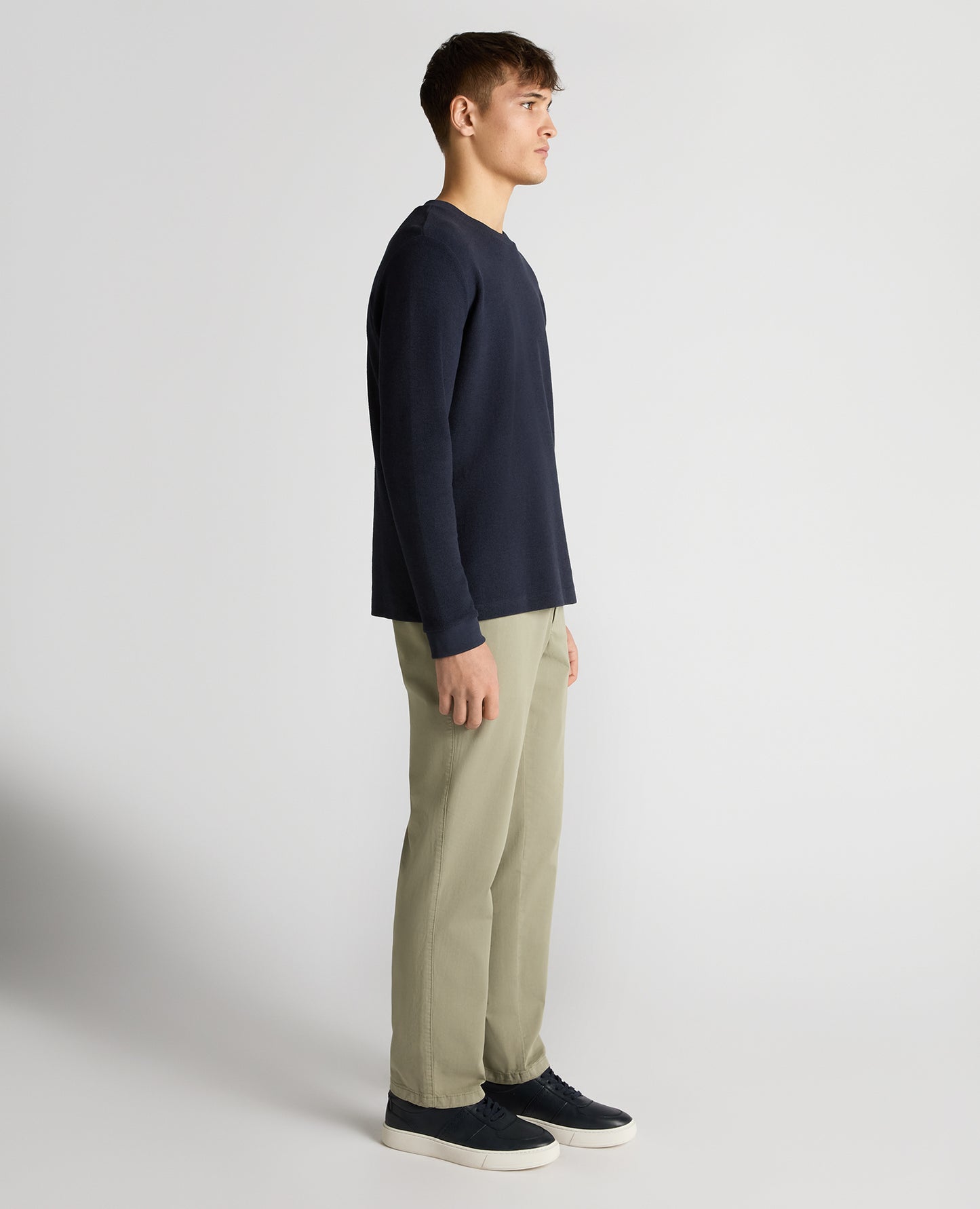 Man wearing a navy Tapered Fit Cotton Micro Waffle Sweatshirt