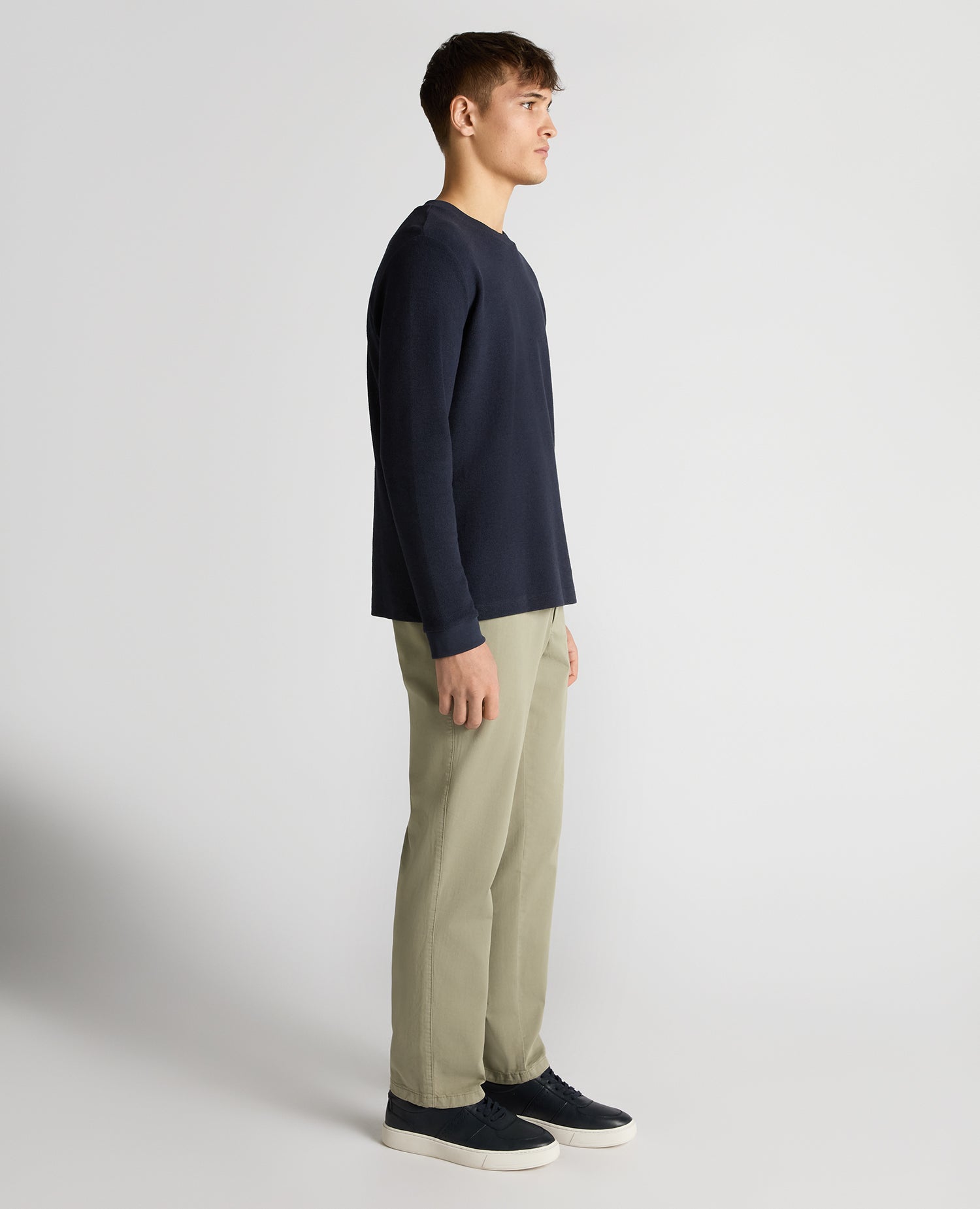 Man wearing a navy Tapered Fit Cotton Micro Waffle Sweatshirt