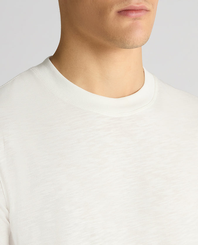 Man wearing a white Tapered Fit Cotton Crew Neck Tee