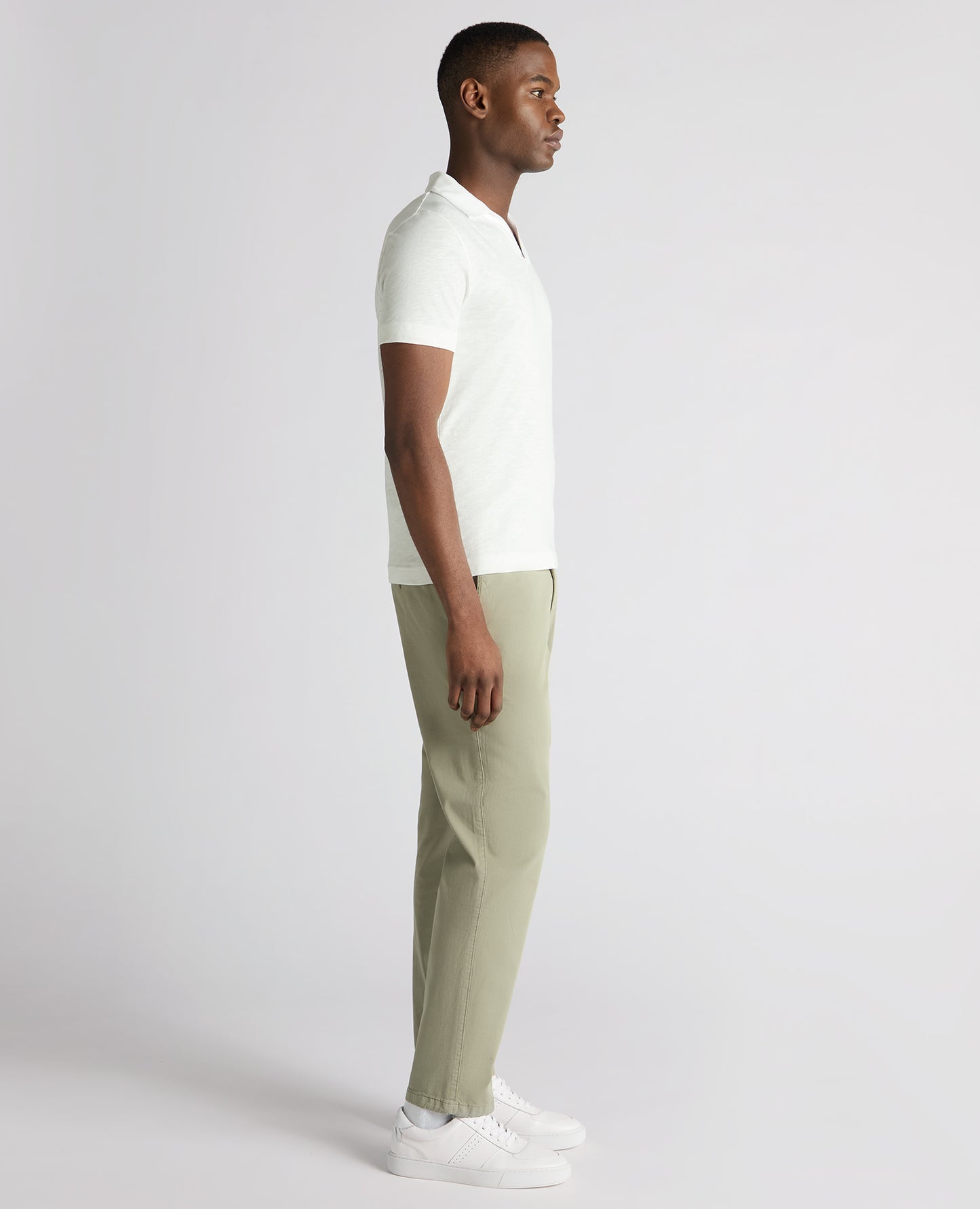 Man wearing a white Tapered Fit Open Collar Cotton Polo