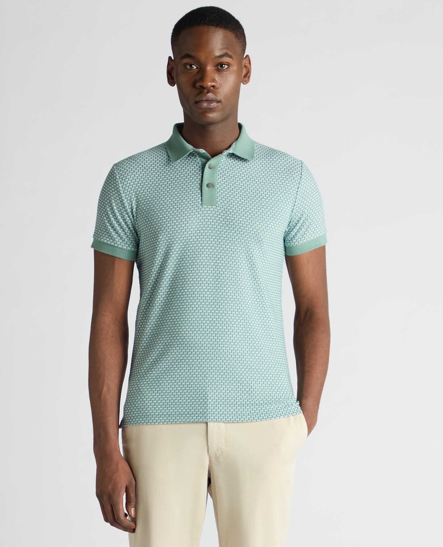 Man wearing a green Tapered Fit Cotton-Blend Polo Shirt