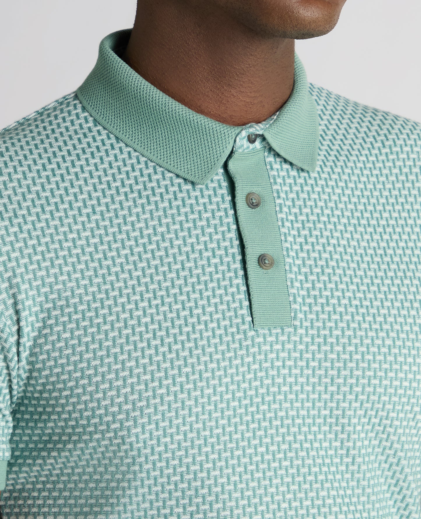 Man wearing a green Tapered Fit Cotton-Blend Polo Shirt