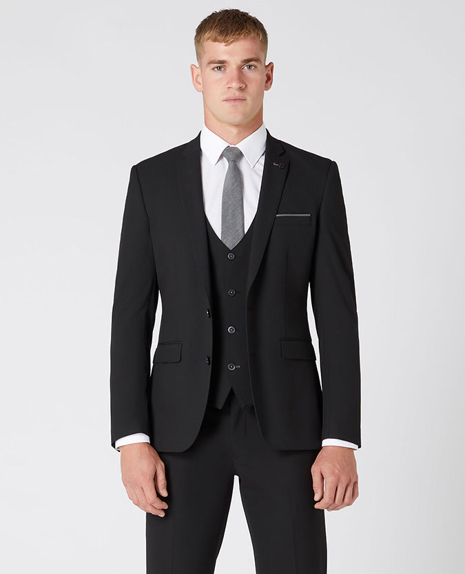 Man wearing a black X-Slim Fit Polyviscose Stretch Mix and Match Suit