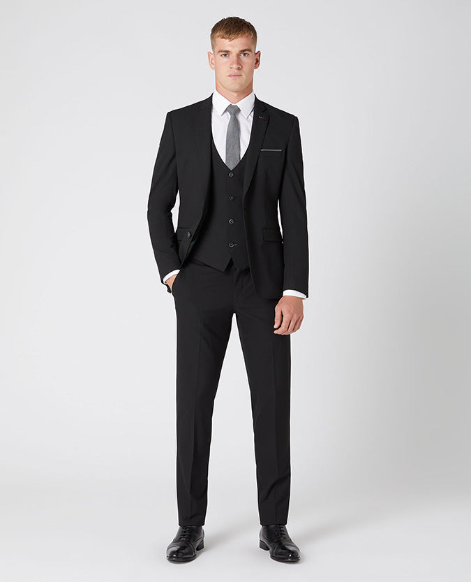 Man wearing a black X-Slim Fit Polyviscose Stretch Mix and Match Suit