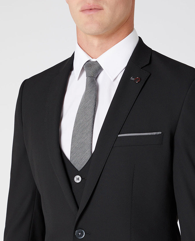 Man wearing a black X-Slim Fit Polyviscose Stretch Mix and Match Suit