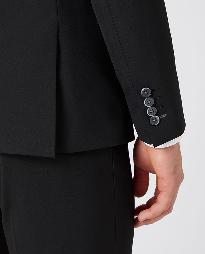 Man wearing a black X-Slim Fit Polyviscose Stretch Mix and Match Suit