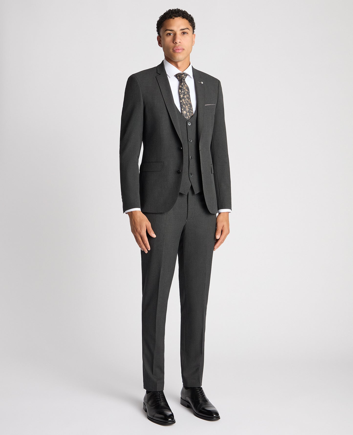 Man wearing a grey X-Slim Fit Stretch Mix and Match Suit Jacket