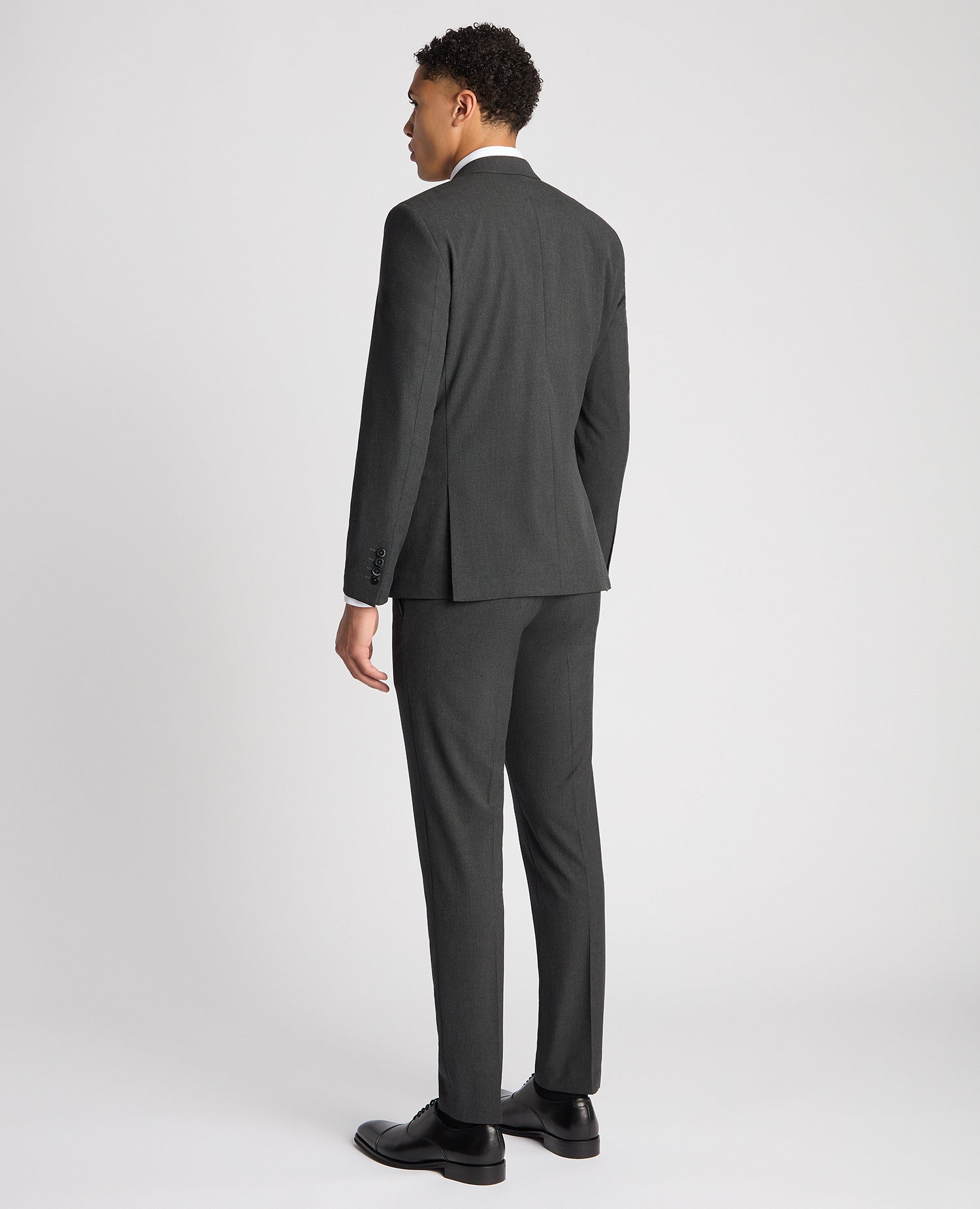 Man wearing a grey X-Slim Fit Stretch Mix and Match Suit Jacket