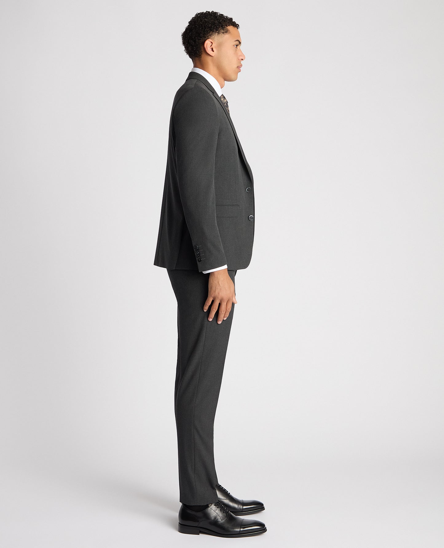 Man wearing a grey X-Slim Fit Stretch Mix and Match Suit Jacket