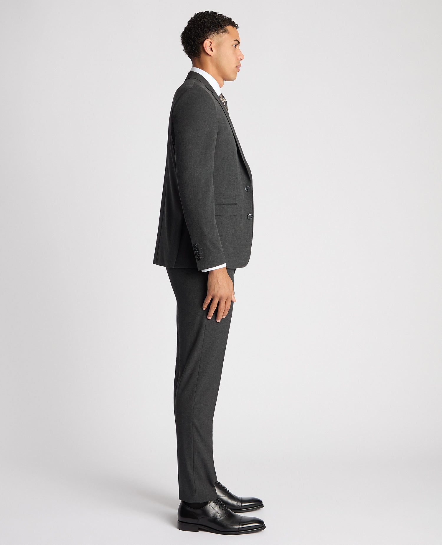 Man wearing a grey X-Slim Fit Stretch Mix and Match Suit Jacket