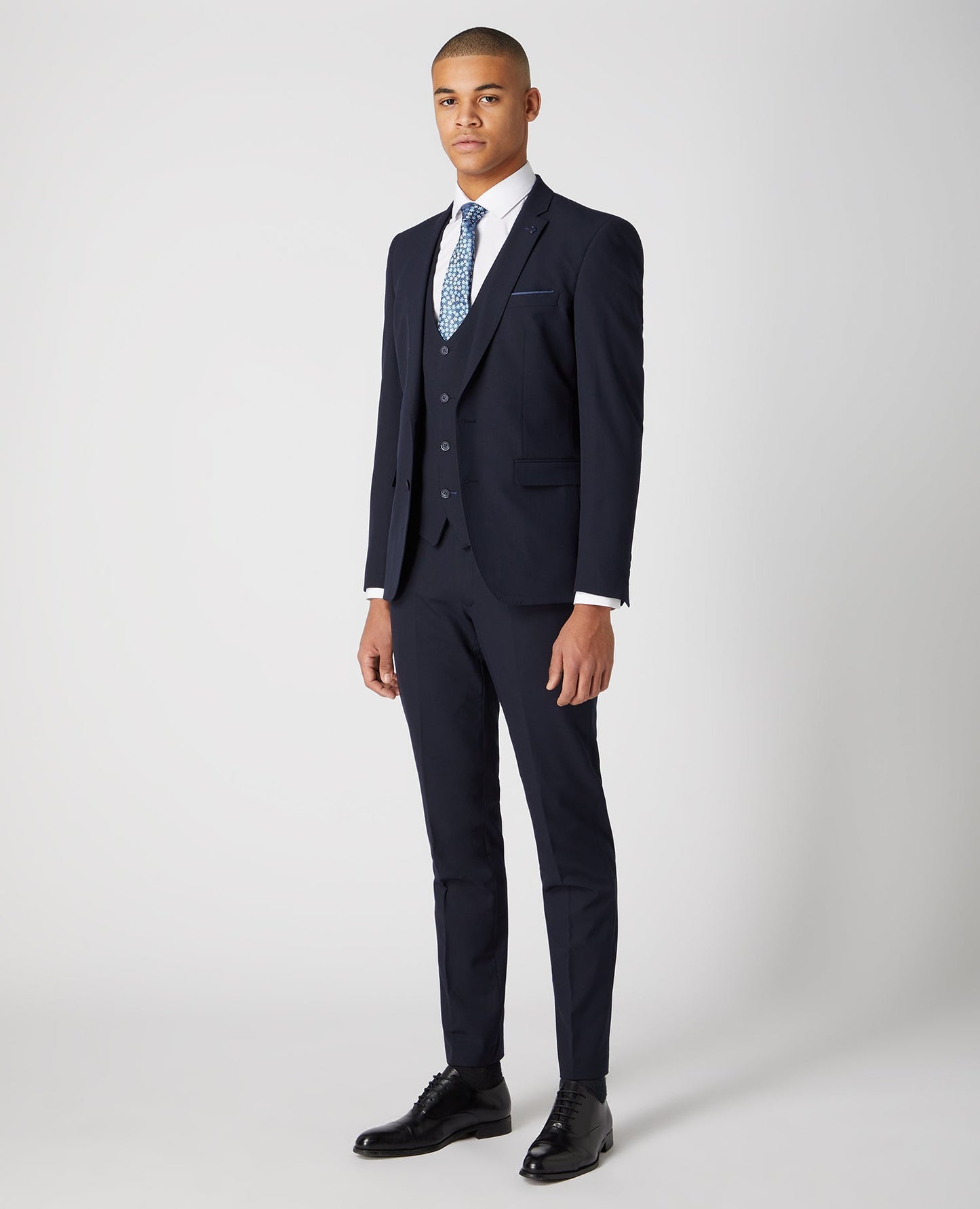 Man wearing a navy X-Slim Fit Stretch Mix and Match Suit