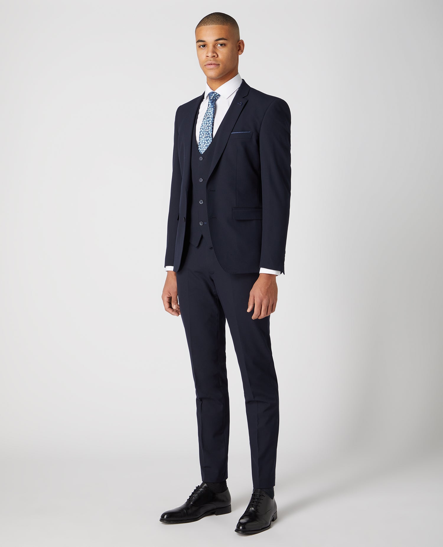 Man wearing a navy X-Slim Fit Stretch Mix and Match Suit