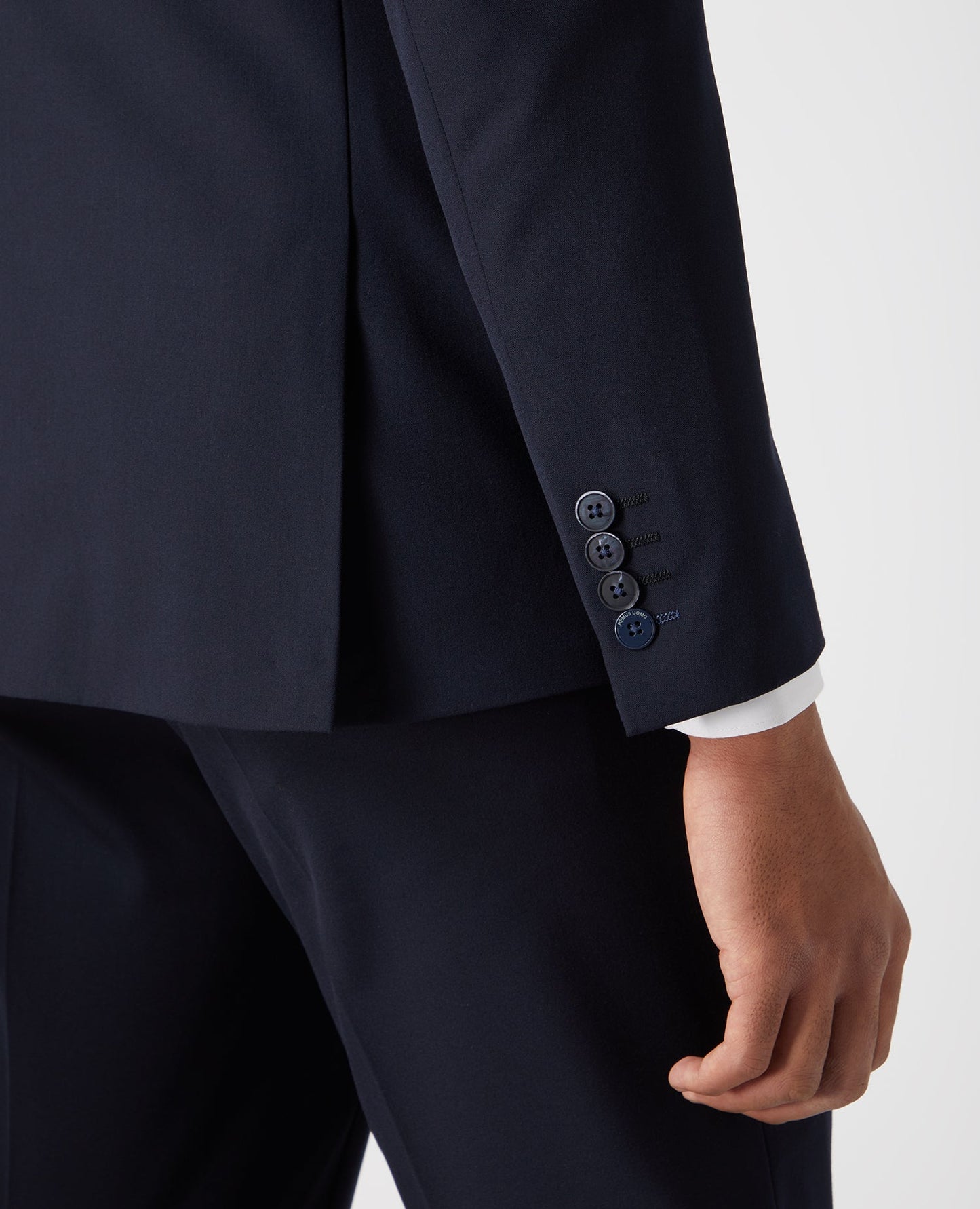 Man wearing a navy X-Slim Fit Stretch Mix and Match Suit