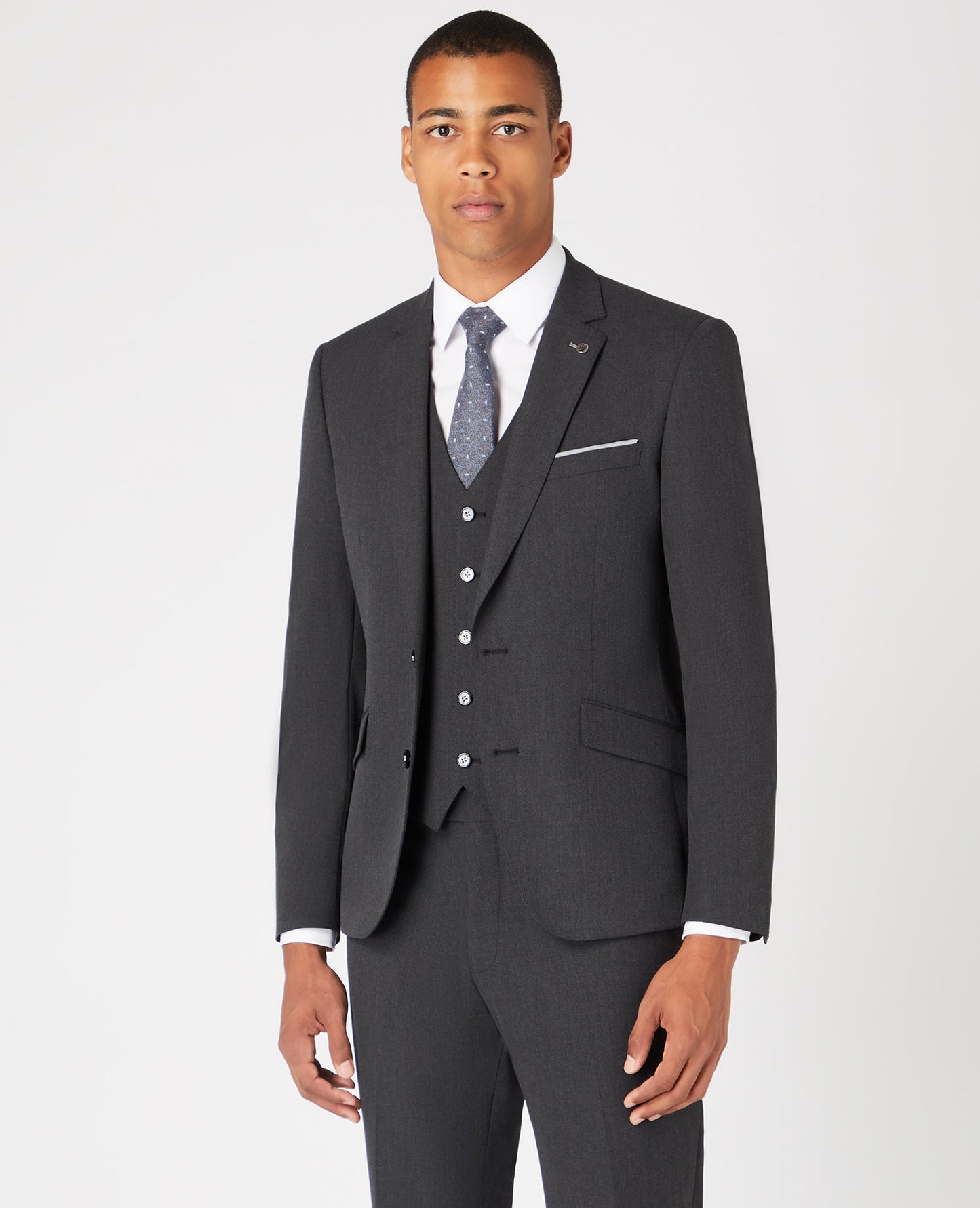Man wearing a grey Tapered Fit Stretch Mix and Match Suit Jacket