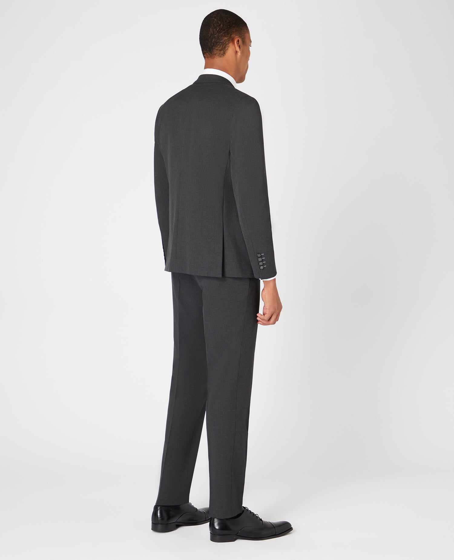 Man wearing a grey Tapered Fit Stretch Mix and Match Suit Jacket