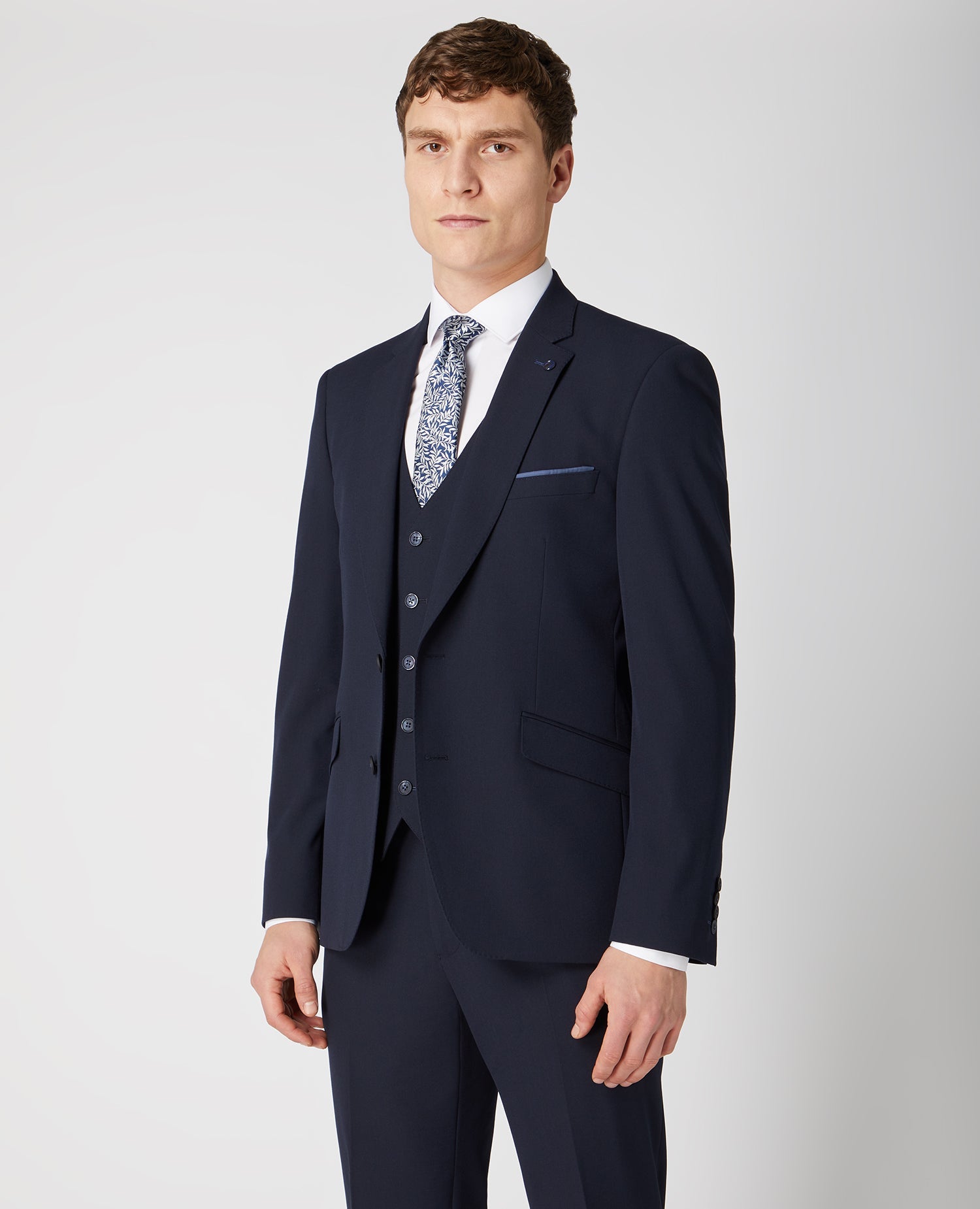 Man wearing a navy Tapered Fit Stretch Mix And Match Suit Jacket