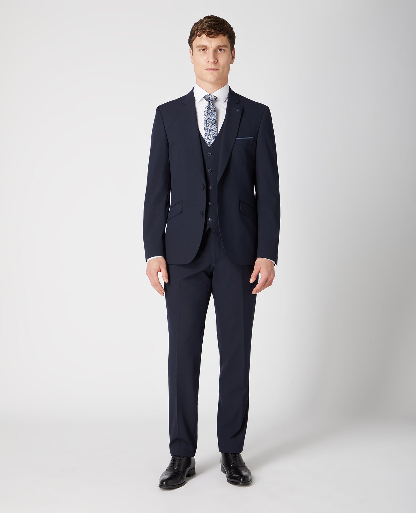 Man wearing a navy Tapered Fit Stretch Mix And Match Suit Jacket