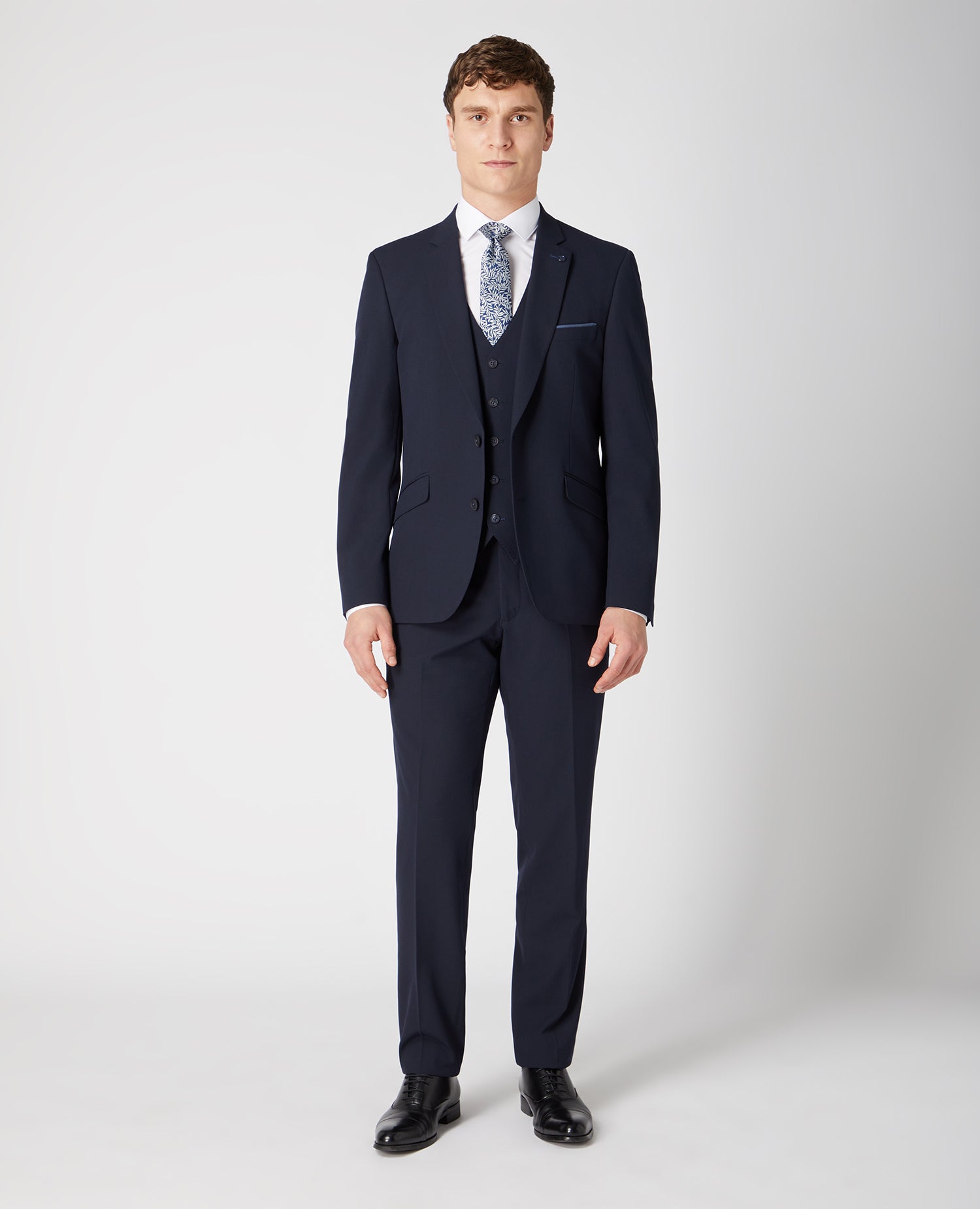 Man wearing a navy Tapered Fit Stretch Mix And Match Suit Jacket