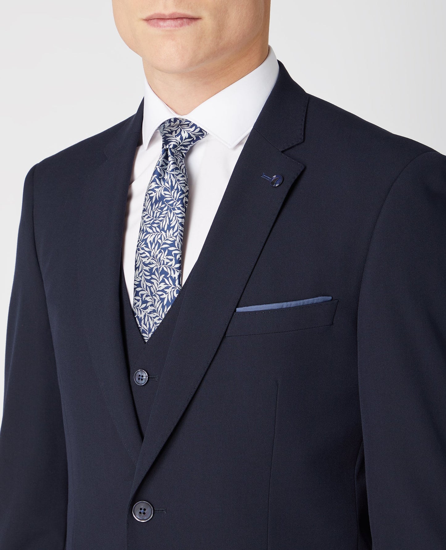 Man wearing a navy Tapered Fit Stretch Mix And Match Suit Jacket