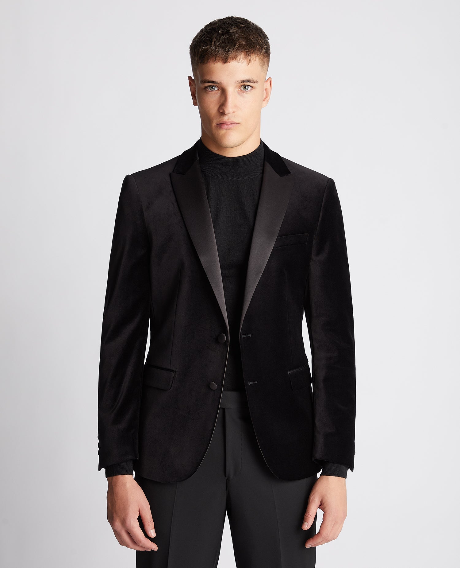 Man wearing a black Slim Fit Velvet Jacket