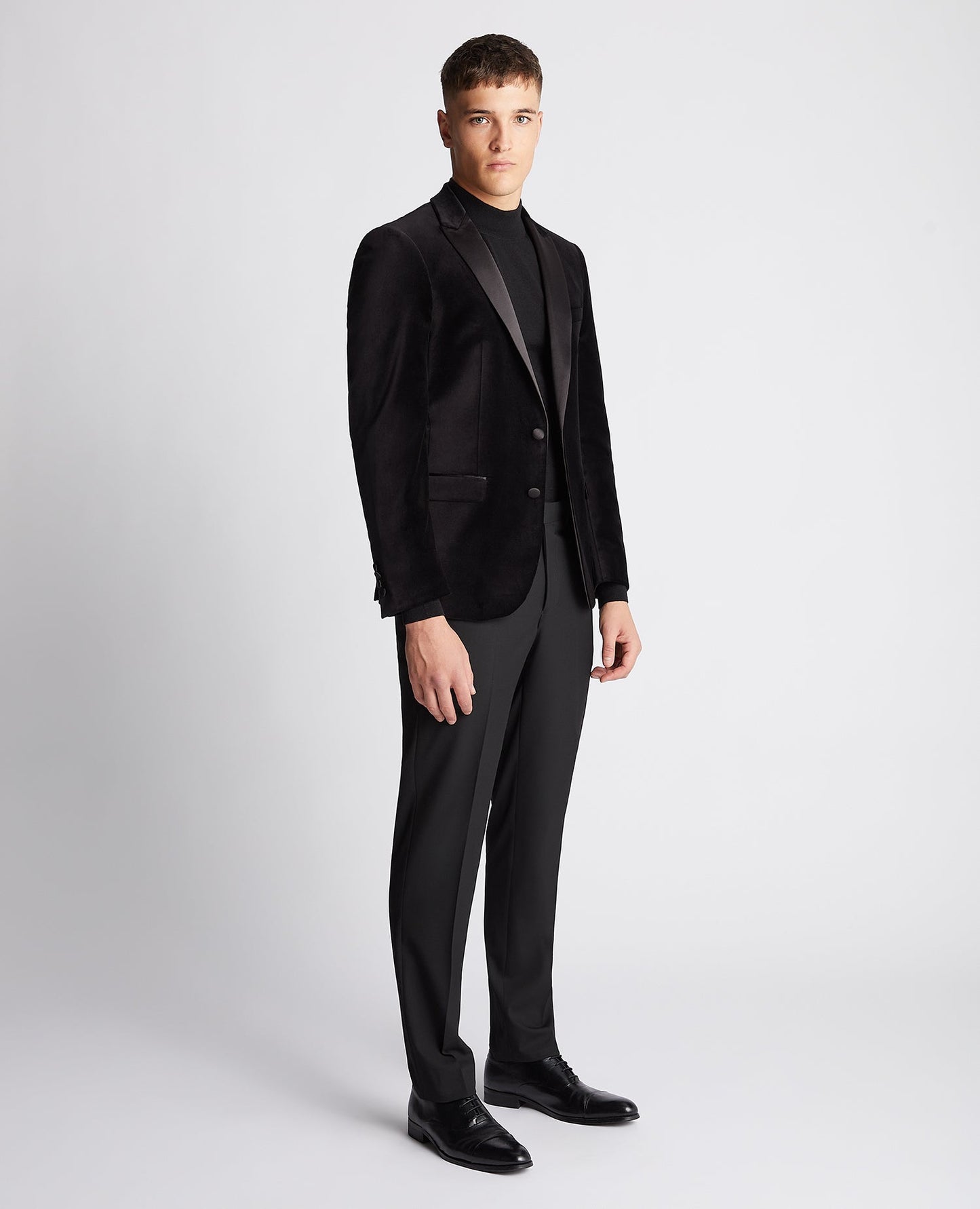 Man wearing a black Slim Fit Velvet Jacket
