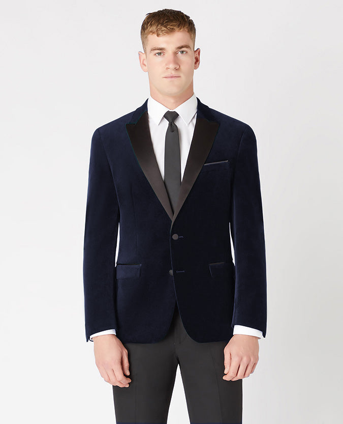 Man wearing a navy Slim Fit Velvet Jacket