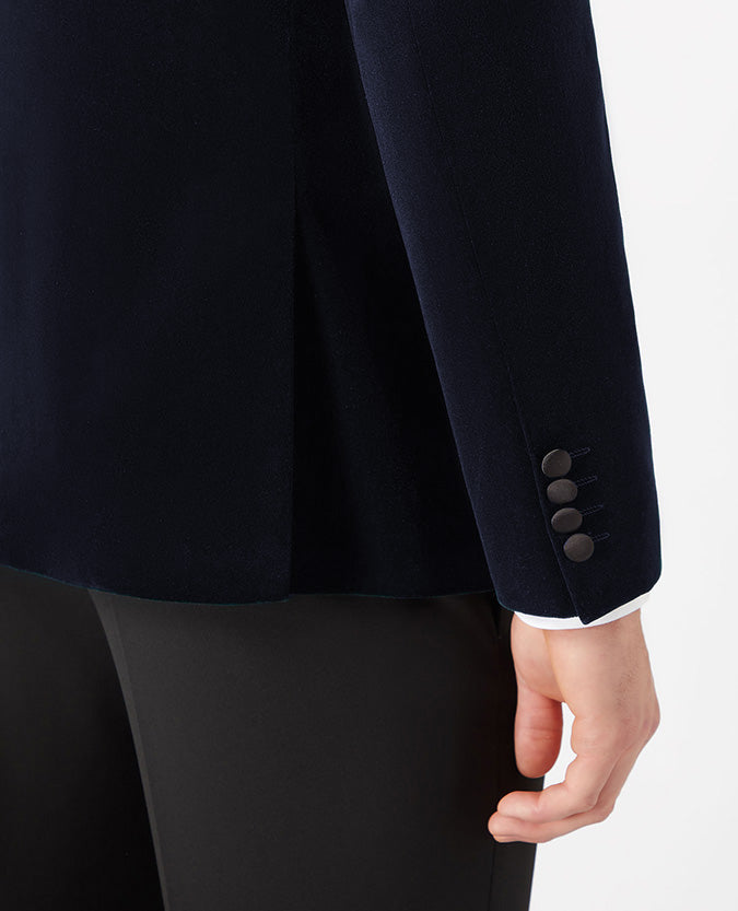 Man wearing a navy Slim Fit Velvet Jacket