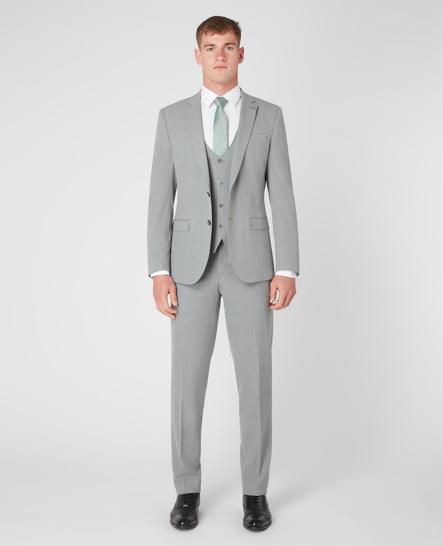 Man wearing a grey Slim Fit Stretch Mix and Match Suit Jacket