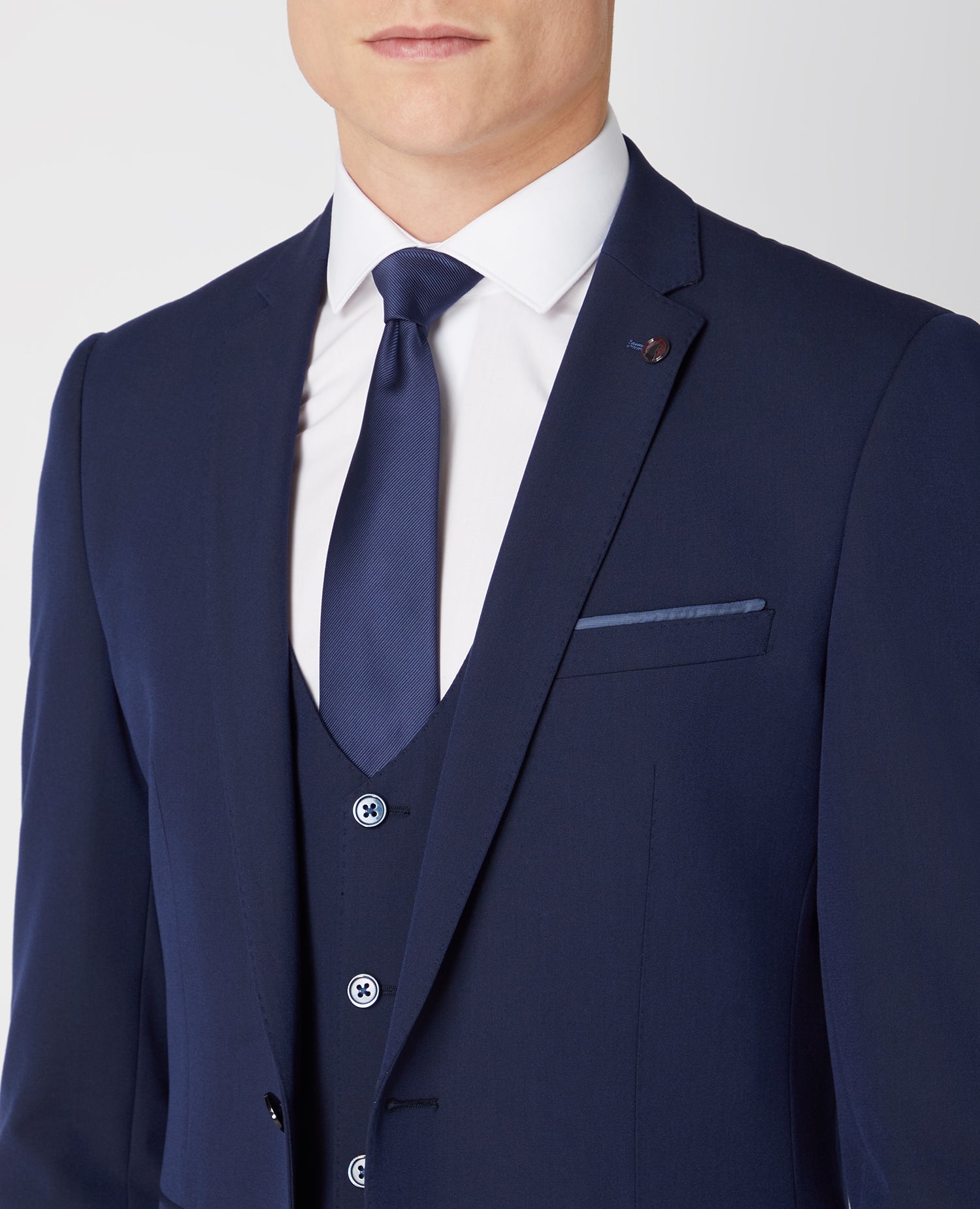 Man wearing a navy Slim Fit Stretch Mix and Match Suit Jacket