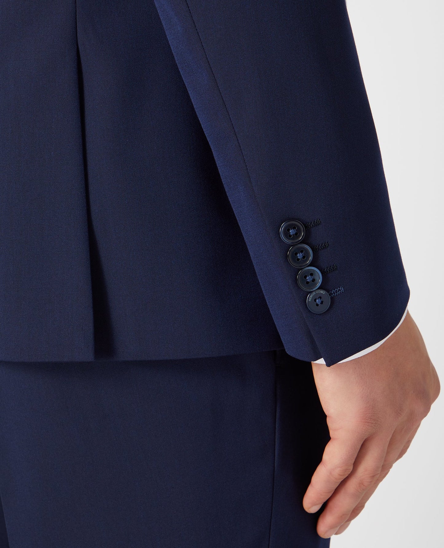 Man wearing a navy Slim Fit Stretch Mix and Match Suit Jacket